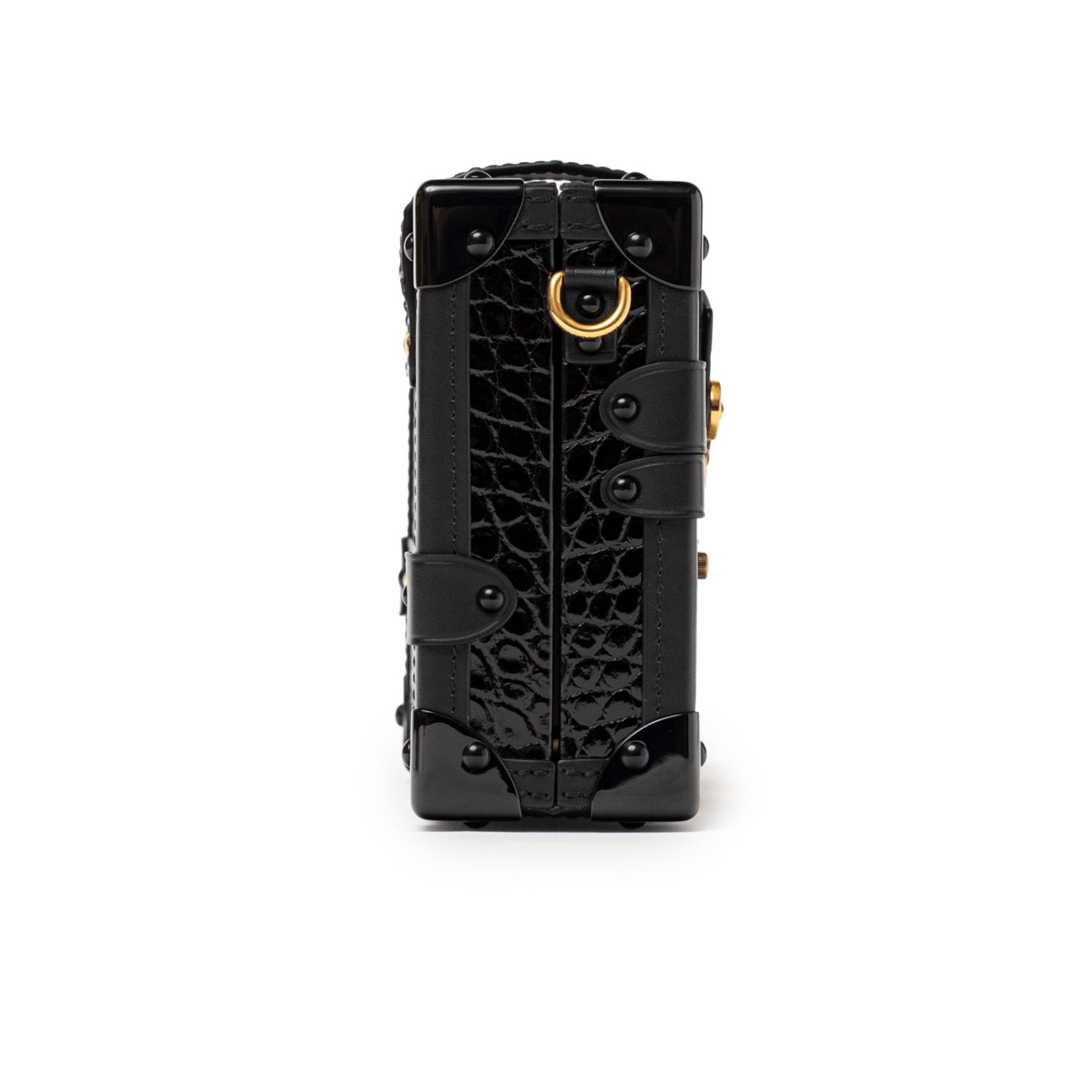 Vertical side view of Louis Vuitton Petite Malle Black Shiny Niloticus Gold Hardware showing structured croc texture and gold ring detail