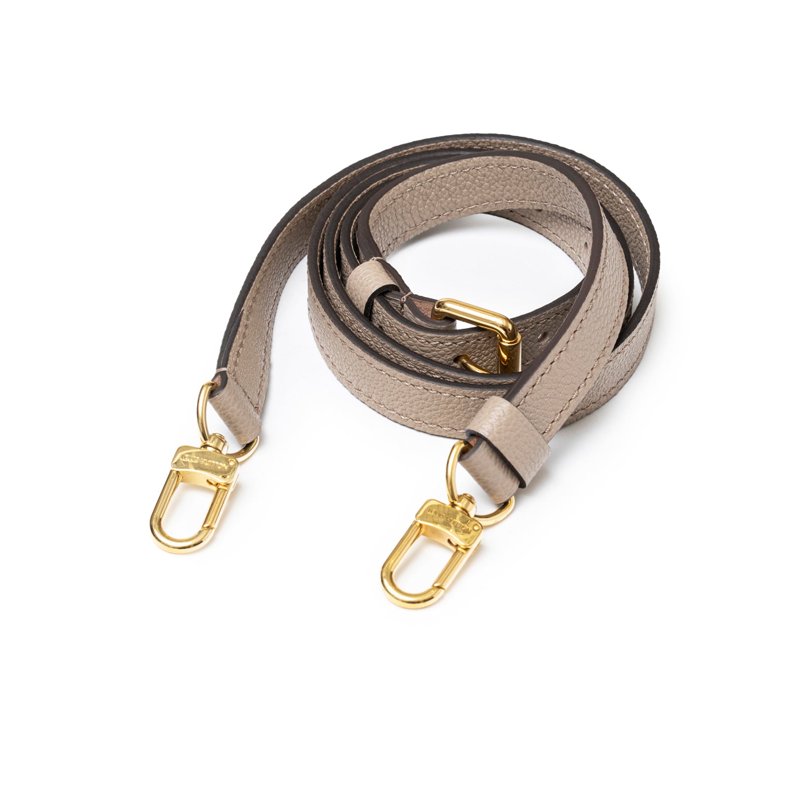 Coiled Louis Vuitton Pochette Métis Monogram Empreinte Turtledove Gold Hardware detachable leather strap close-up view