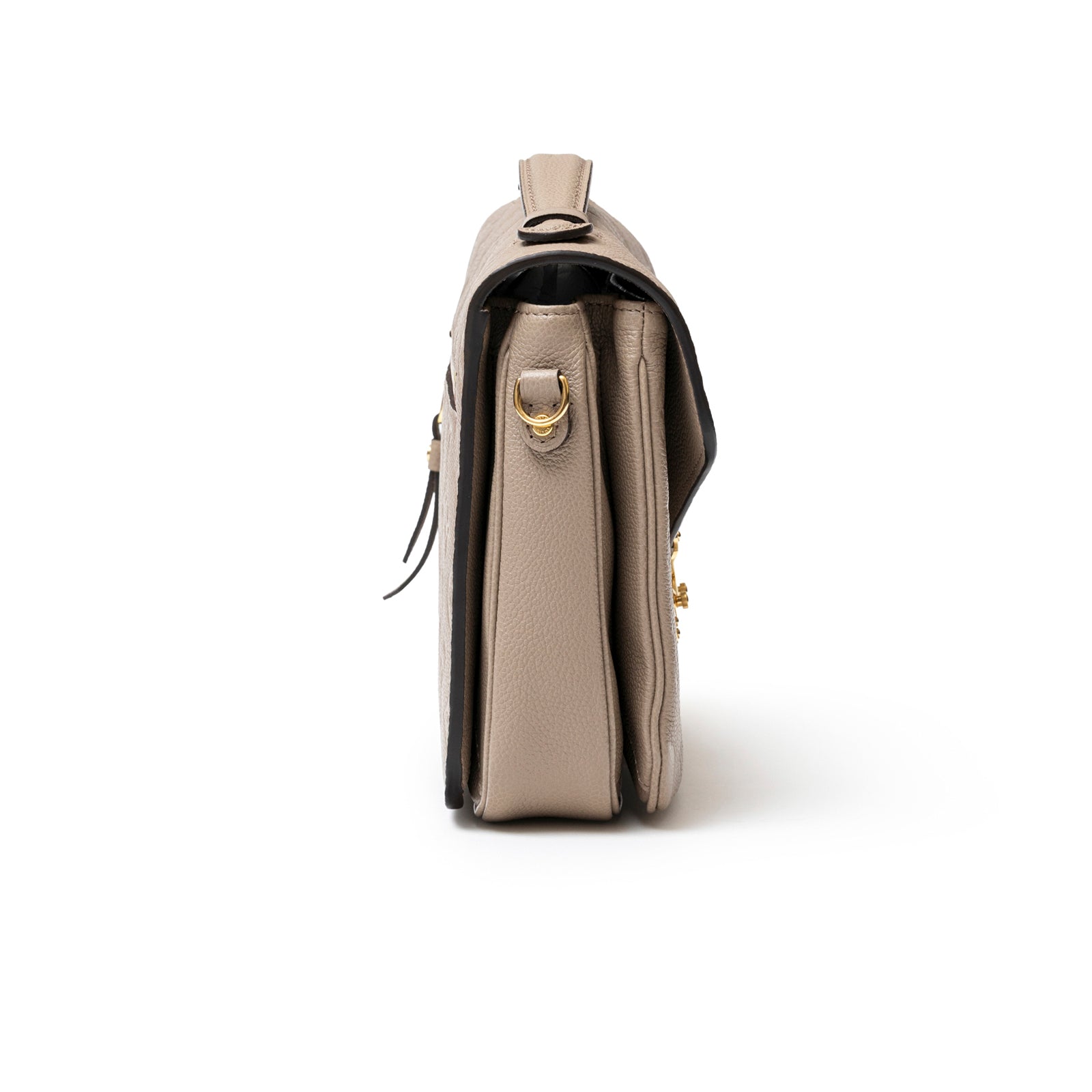 Side view of Louis Vuitton Pochette Métis Monogram Empreinte Turtledove Gold Hardware bag showing texture and hardware details