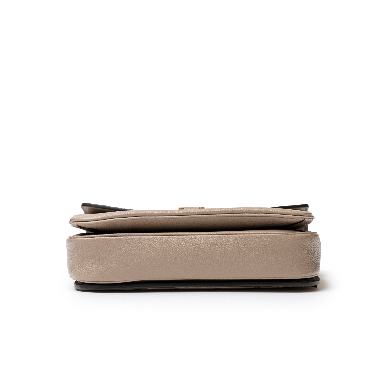 Bottom view showing the textured leather base of Louis Vuitton Pochette Métis Monogram Empreinte Turtledove Gold Hardware