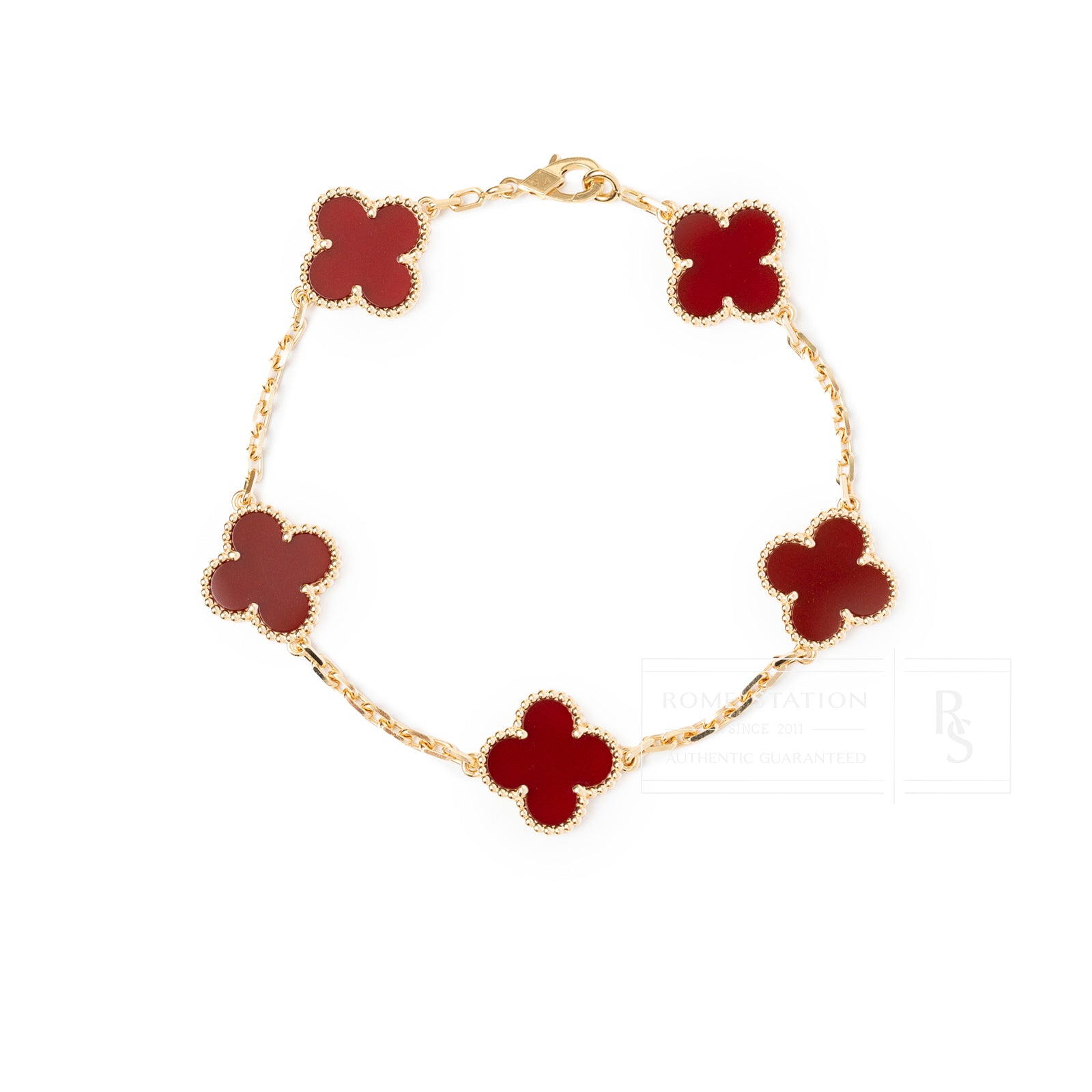 Van Cleef & Arpels Vintage Alhambra 5 motifs Bracelet 18K Yellow Gold Carnelian in top-down view showing red motifs and gold chain links.