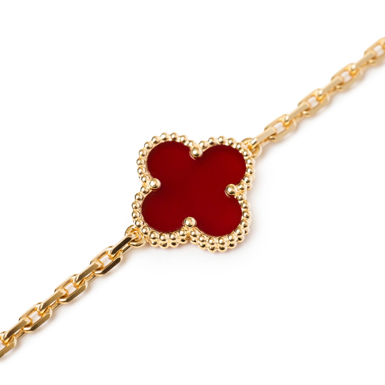 Close-up of Van Cleef & Arpels Vintage Alhambra 5 motifs Bracelet 18K Yellow Gold Carnelian with detailed gold beaded edges