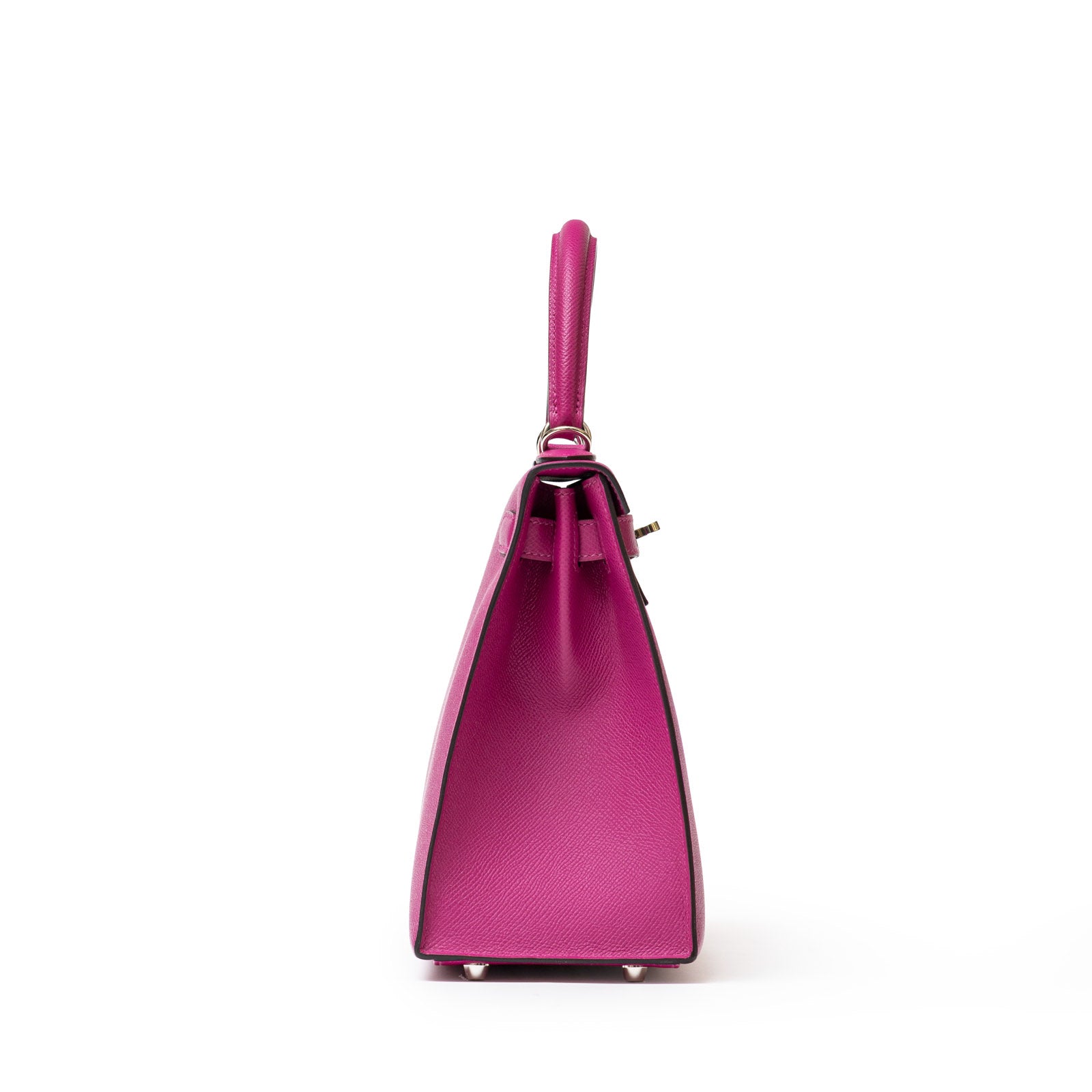 Side view of Hermès Kelly 28 Sellier Rose Pourpre with structured design and top handle on white background.