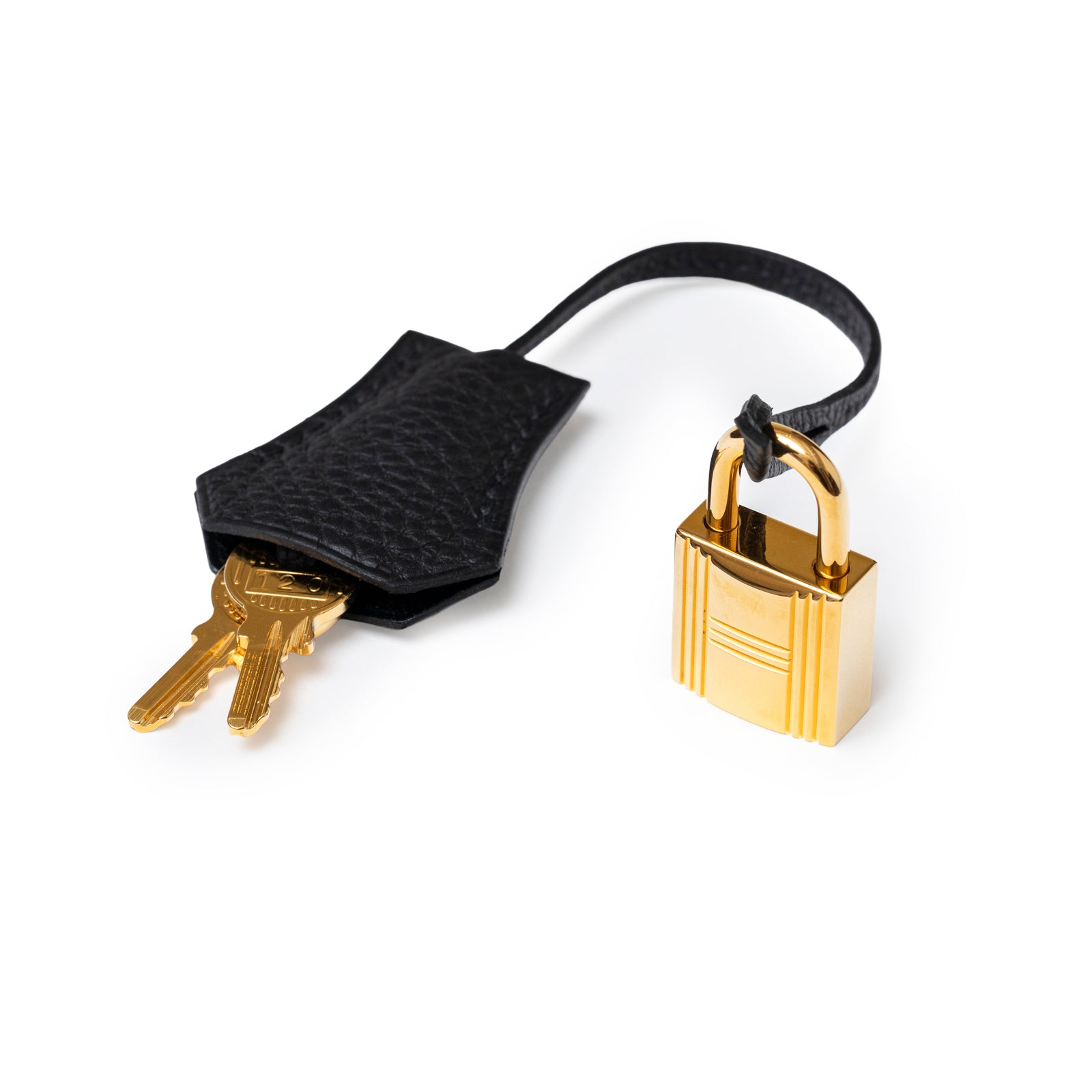 Close-up of Hermès Birkin 25 Black Togo Gold Hardware padlock and key holder with two gold keys visible