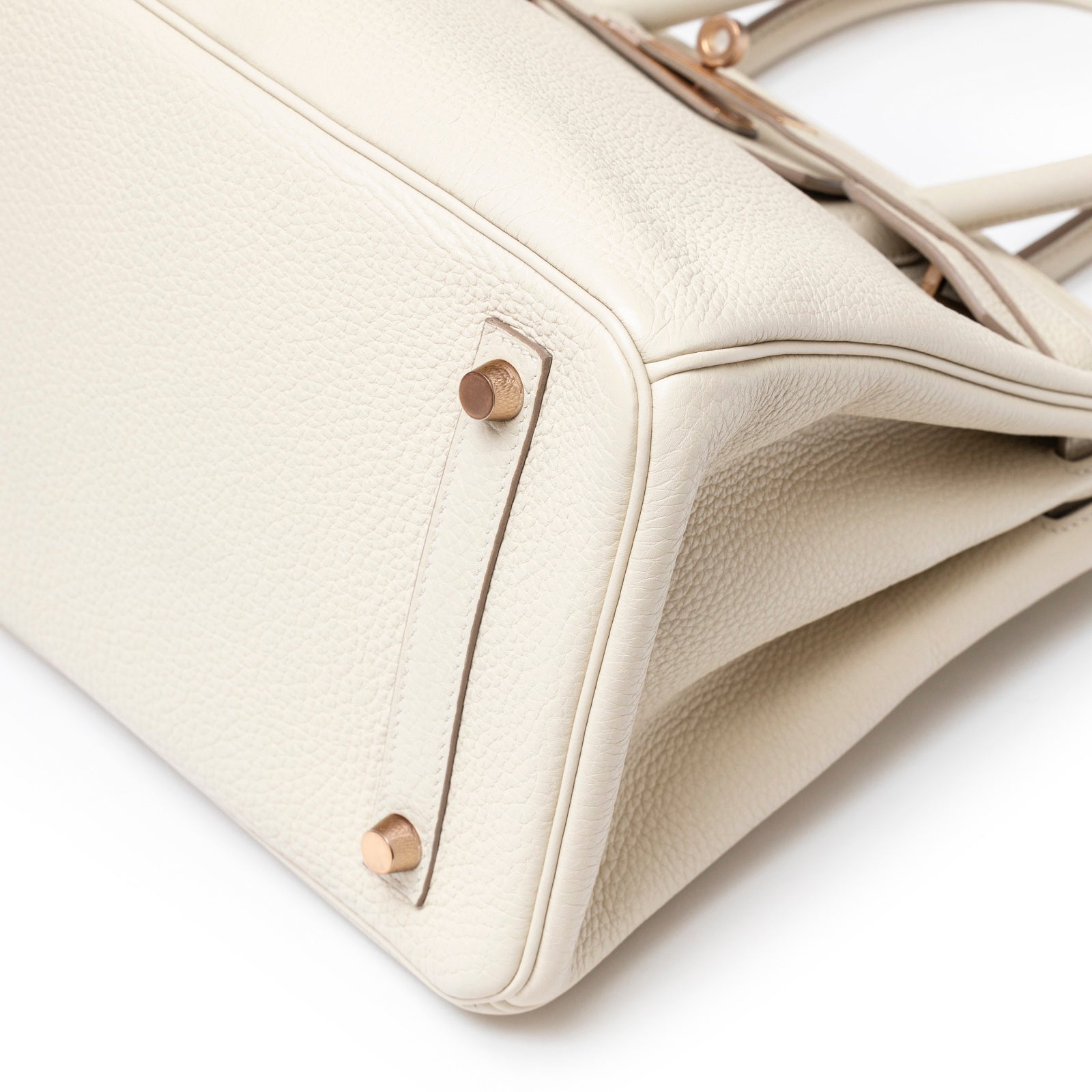 Close-up of bottom corner showing rose gold hardware and Craie Togo leather on Hermès Birkin 30 Craie Togo Rose Gold Hardware