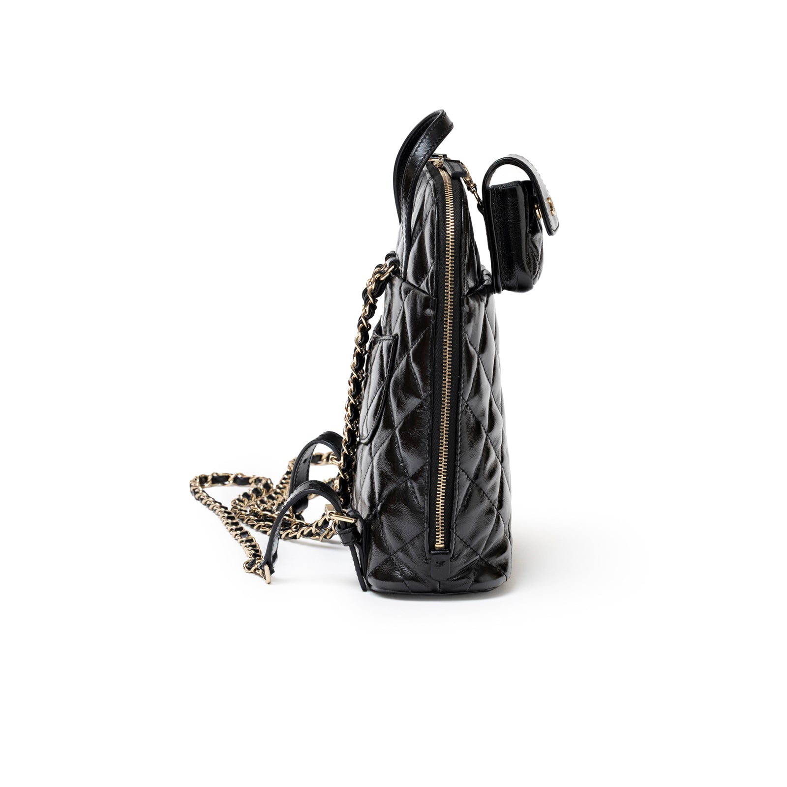 Side view of Chanel My Pocket Backpack Black Shiny Calfskin Gold Hardware with quilted texture and chain strap