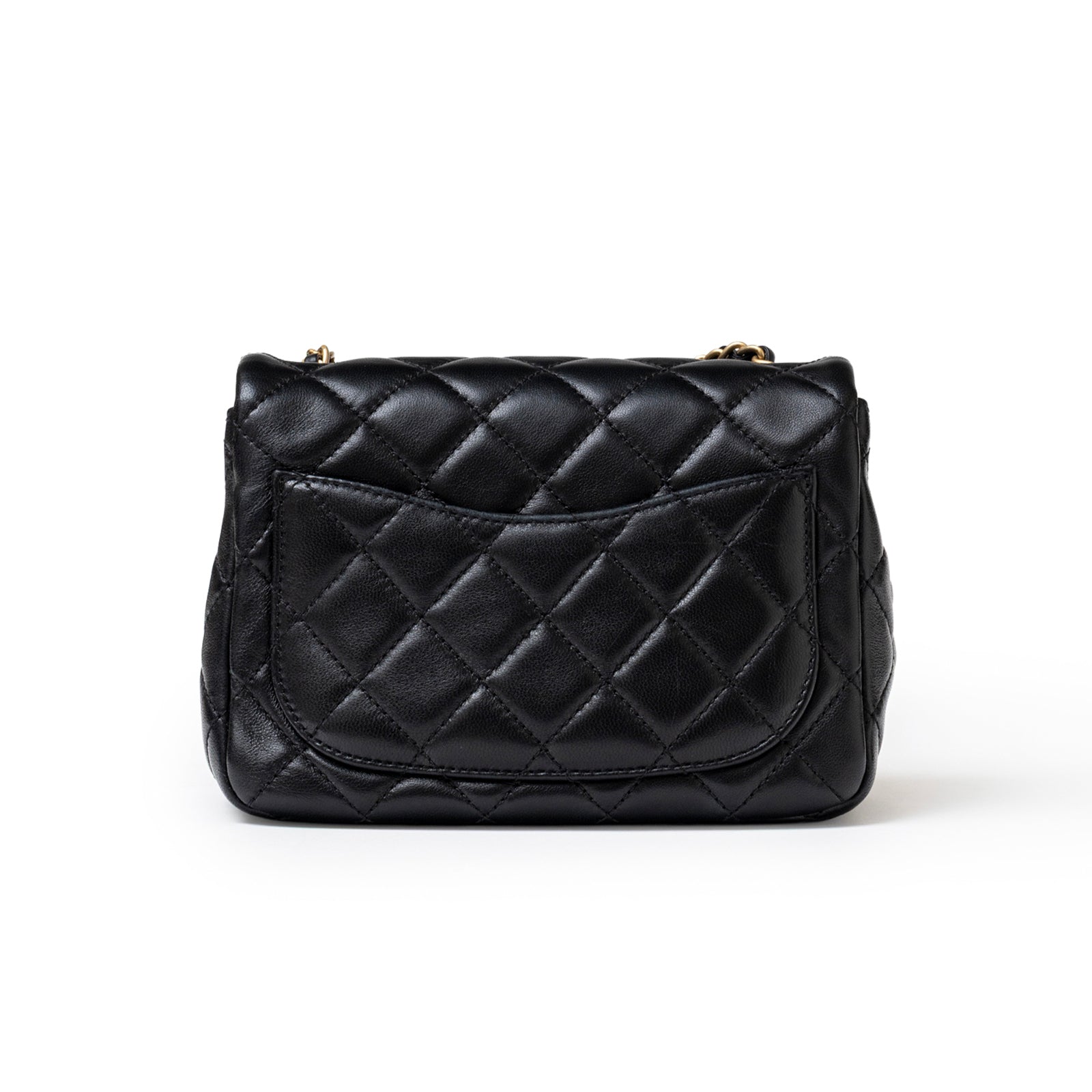Back view of Chanel Mini Square Pearl Crush Flap Bag Black Lambskin Aged Brushed Gold Hardware showing quilted pocket detail