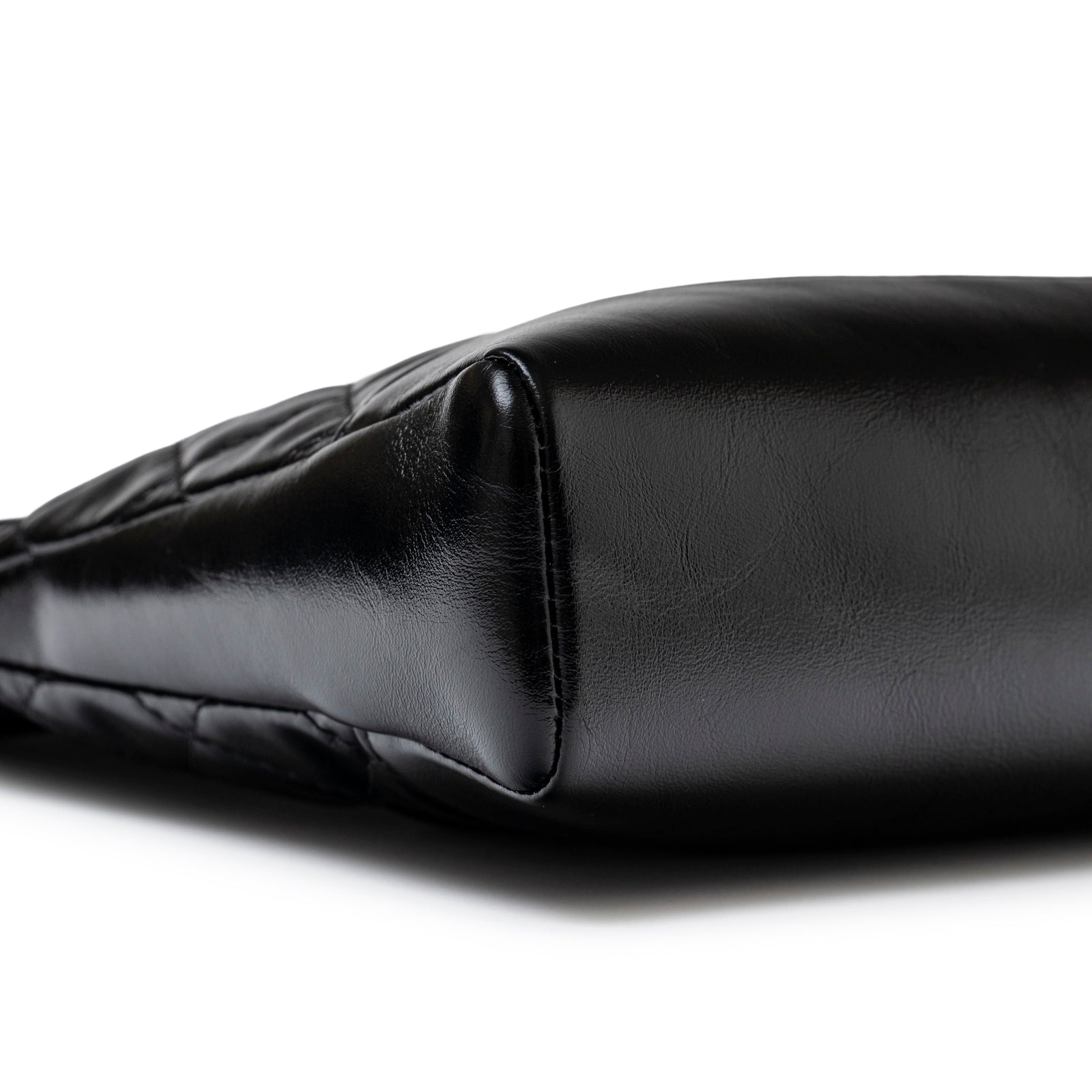 Close-up of the base showing smooth calfskin on the Chanel Mini 31 Shopping Tote Calfskin Black Gold Hardware