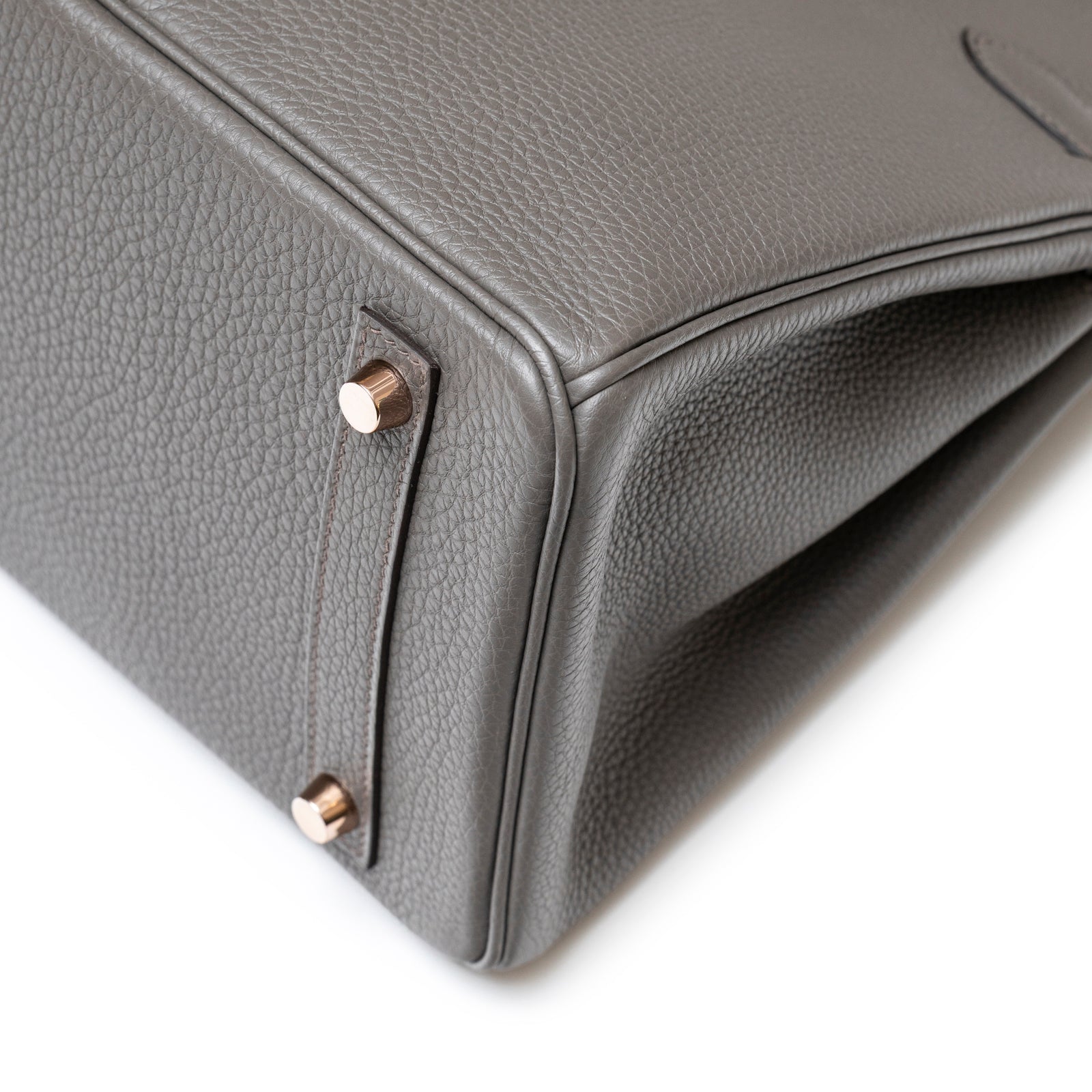 Close-up of corner and rose gold feet on Hermès Birkin 30 Etain Togo Rose Gold Hardware handbag detailing