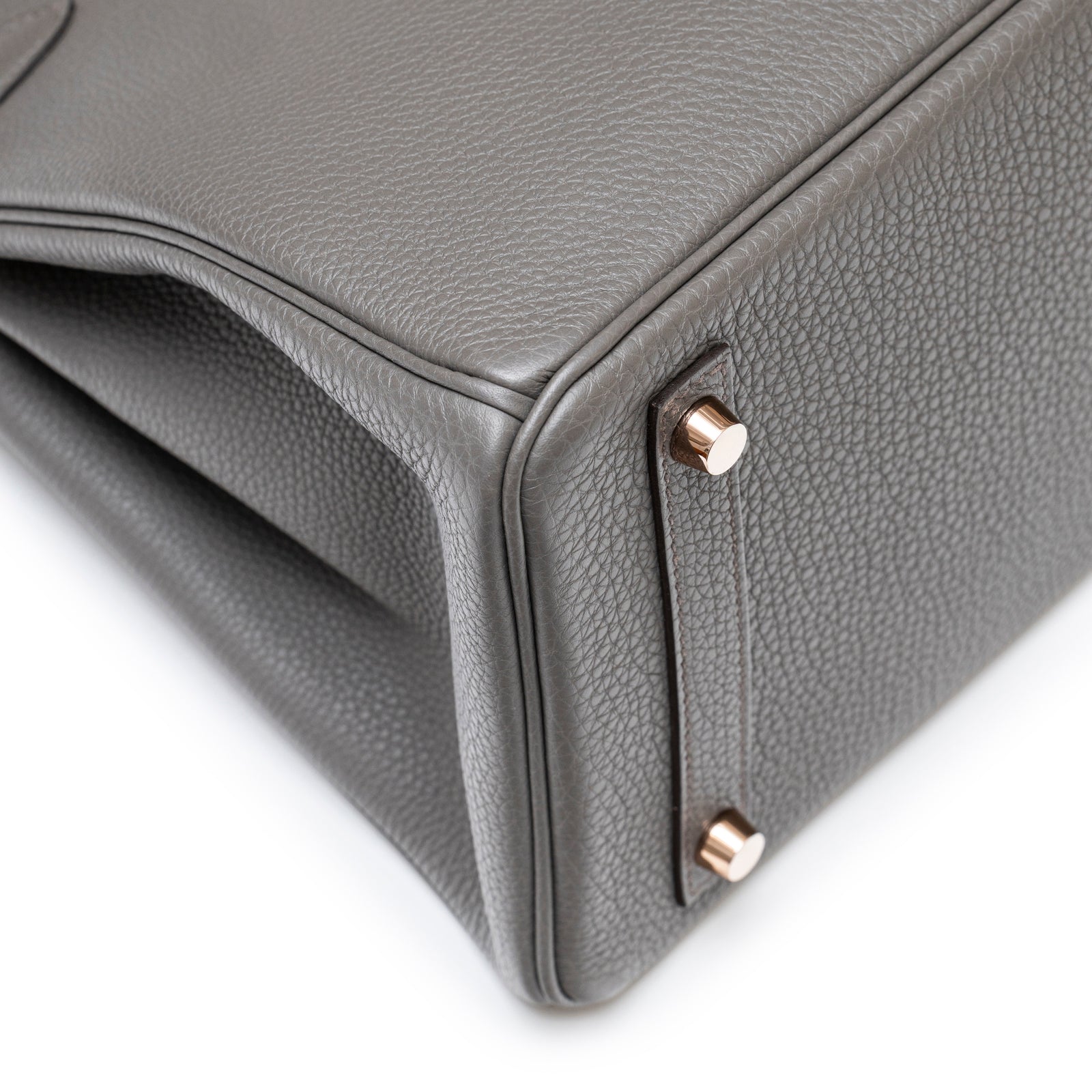 Close-up of the bottom corner showing rose gold hardware feet on Hermès Birkin 30 Etain Togo Rose Gold Hardware bag