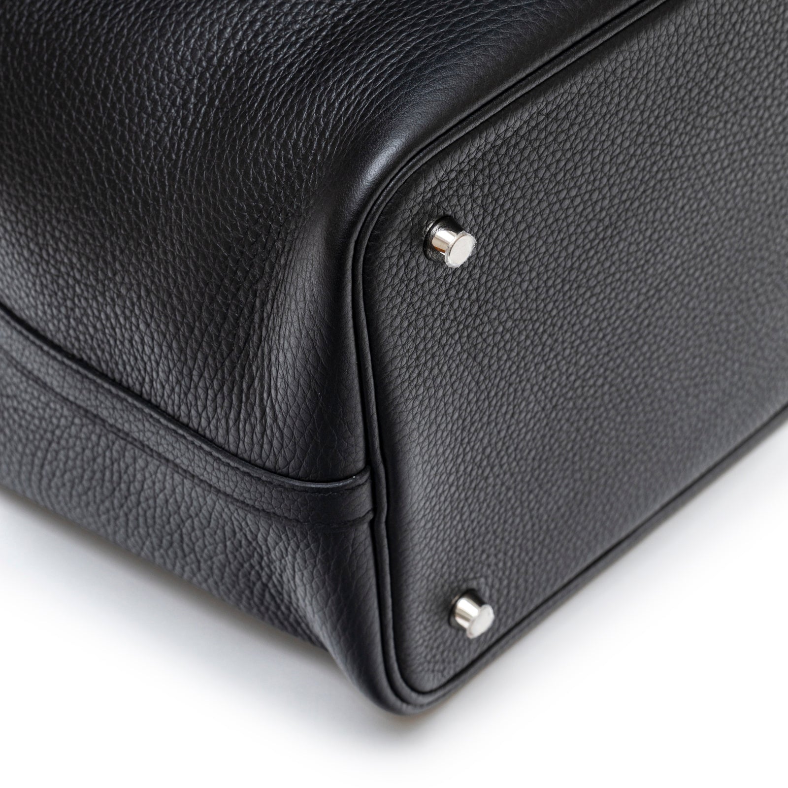Close-up of bottom corner and palladium hardware on Hermès Picotin 22 Black Clemence Palladium Hardware bag