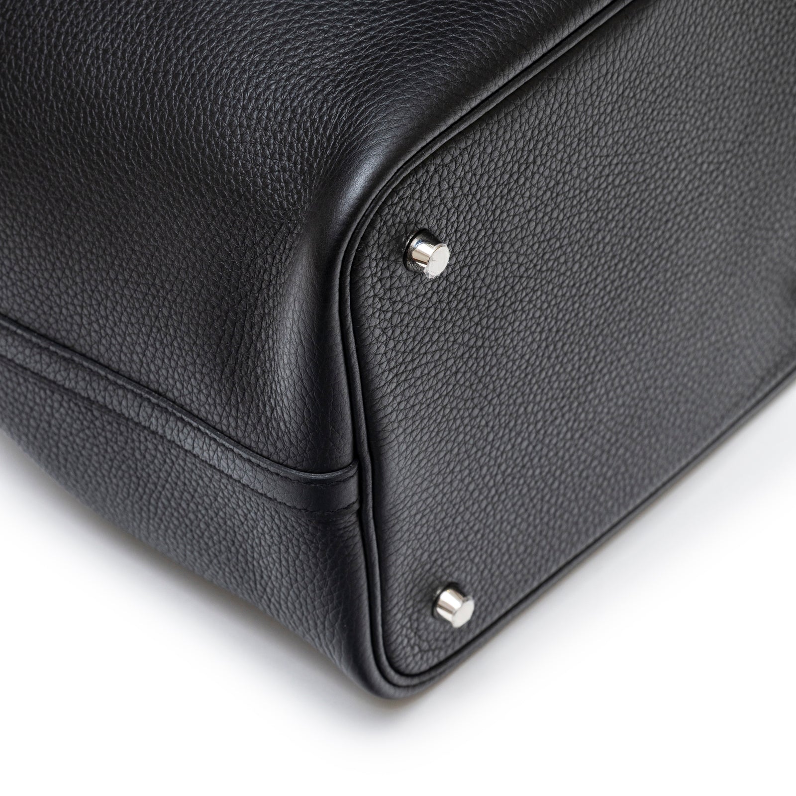 Close-up of bottom corner with palladium hardware on Hermès Picotin 22 Black Clemence Palladium Hardware bag