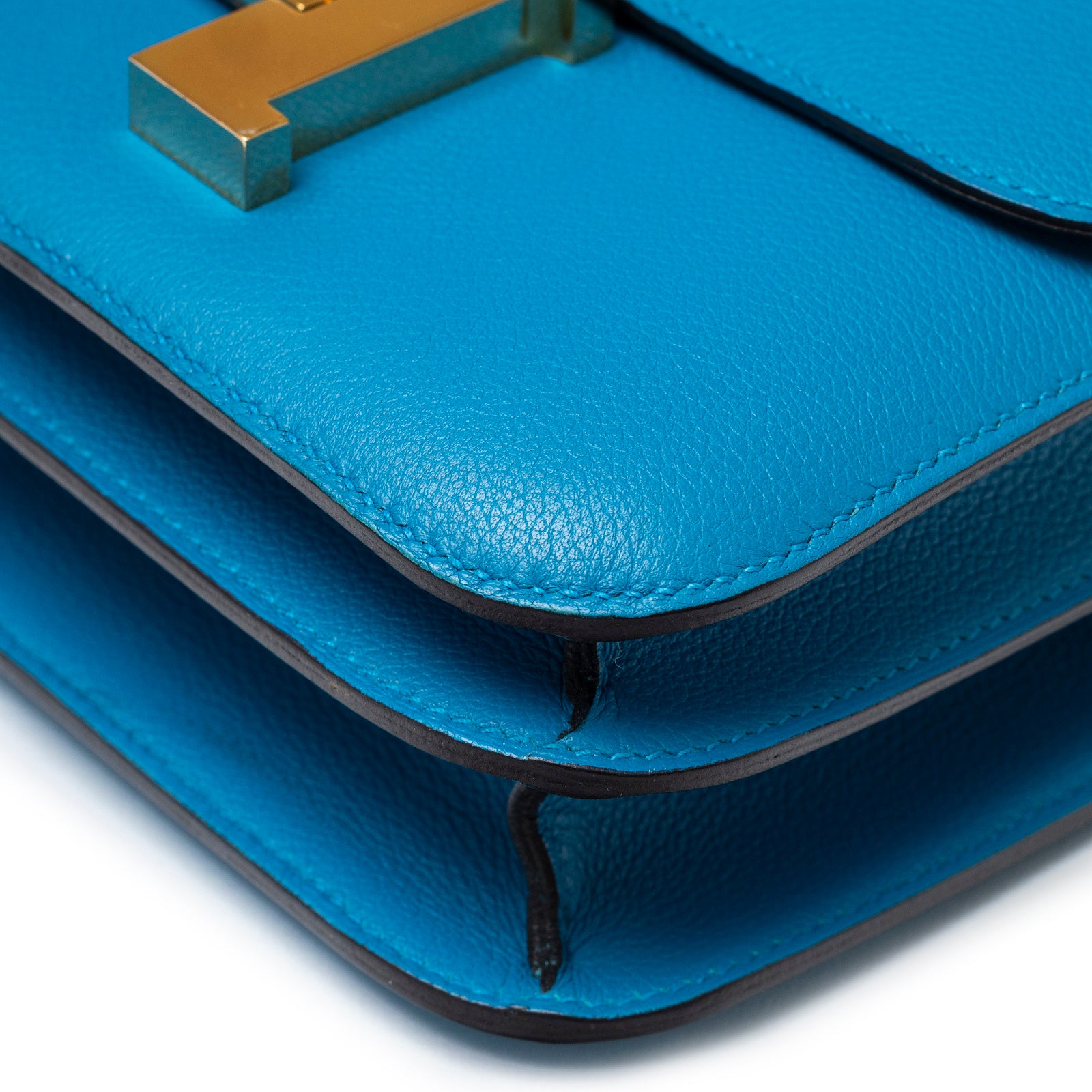 Close-up of Hermès Constance 24 Blue Zanzibar Evercolor Gold Hardware corner and leather texture details