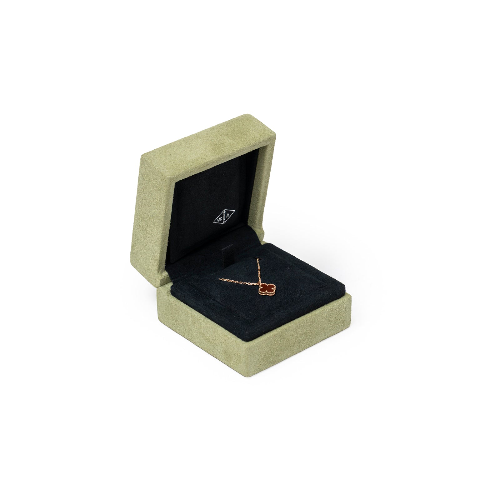 Van Cleef & Arpels Sweet Alhambra Pendant 18K Rose Gold/Carnelian displayed inside gray suede jewelry box angled shot
