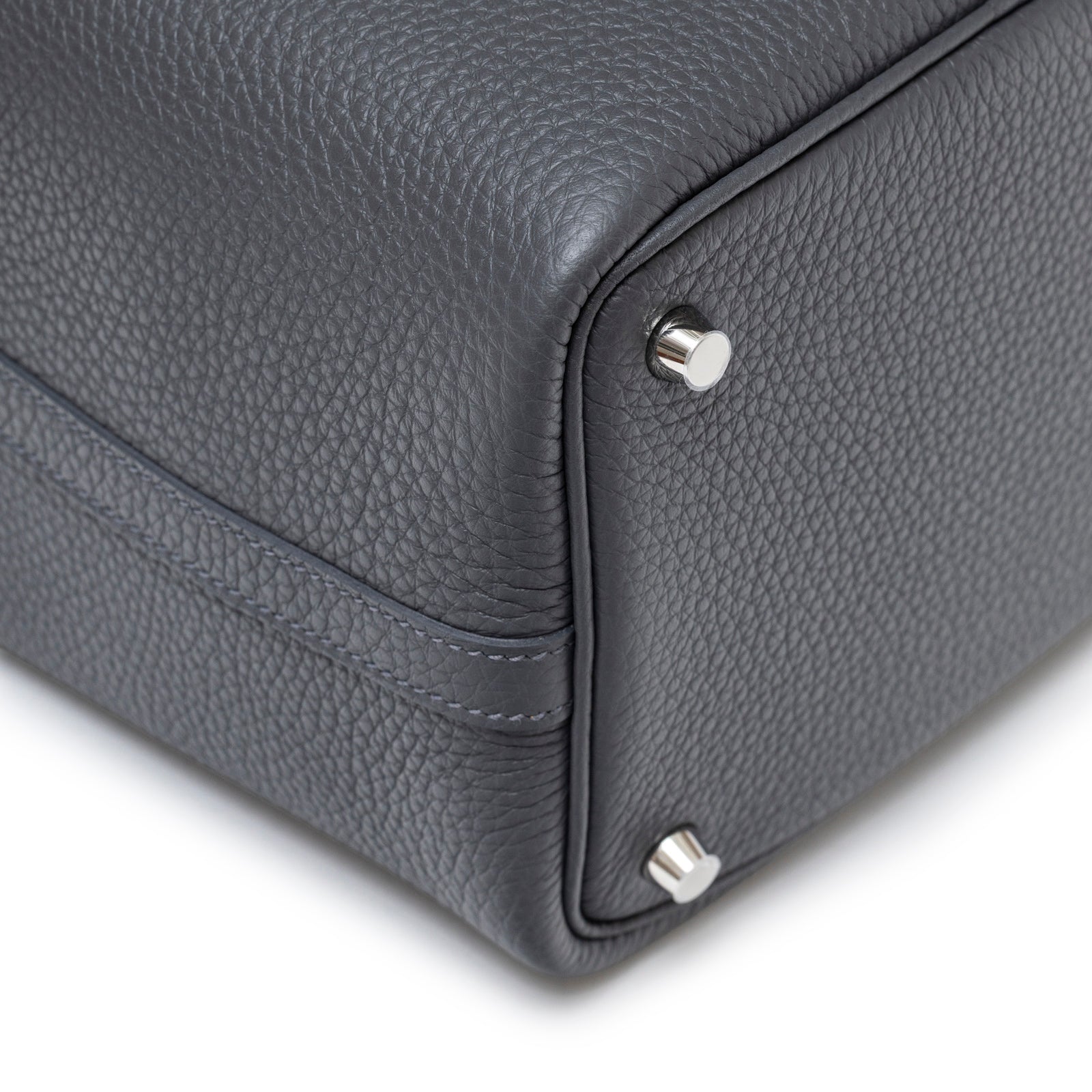Close-up angled shot of the Hermès Picotin 18 Ardosie Clemence Palladium Hardware bottom corner showing texture and metal feet