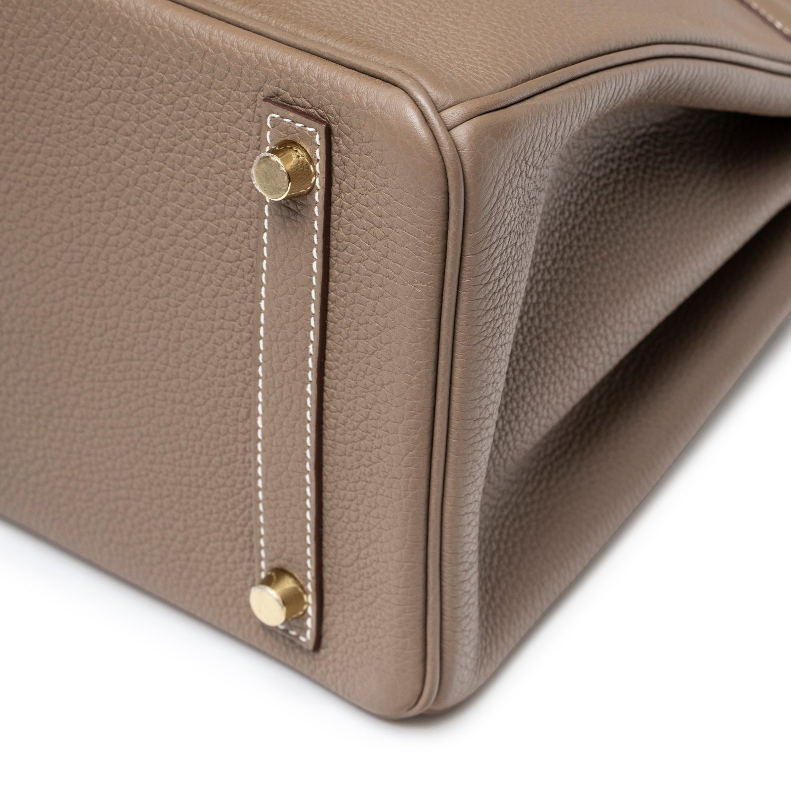 Close-up of base corner showing textured Etoupe Togo leather and gold hardware feet on Hermès Birkin 30 Etoupe Togo Gold Hardware