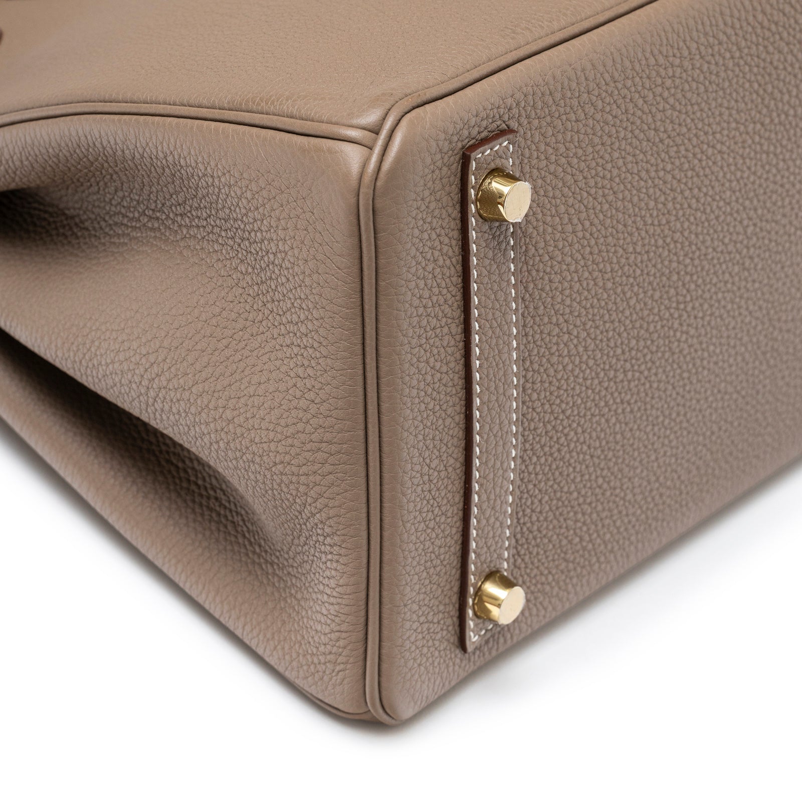 Close-up of Hermès Birkin 30 Etoupe Togo Gold Hardware corner showing leather texture and gold studs detail