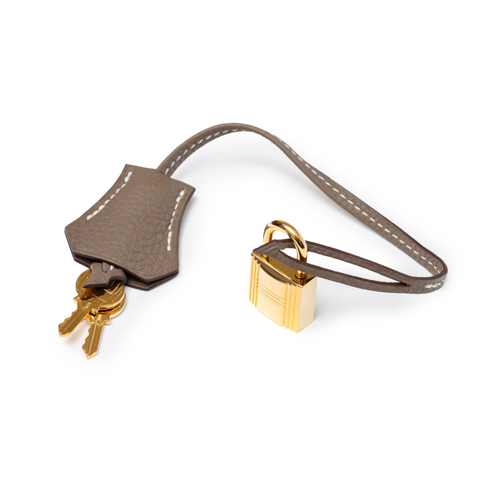 Close-up of Hermès Birkin 30 Etoupe Togo Gold Hardware lock and keys with leather clochette detail