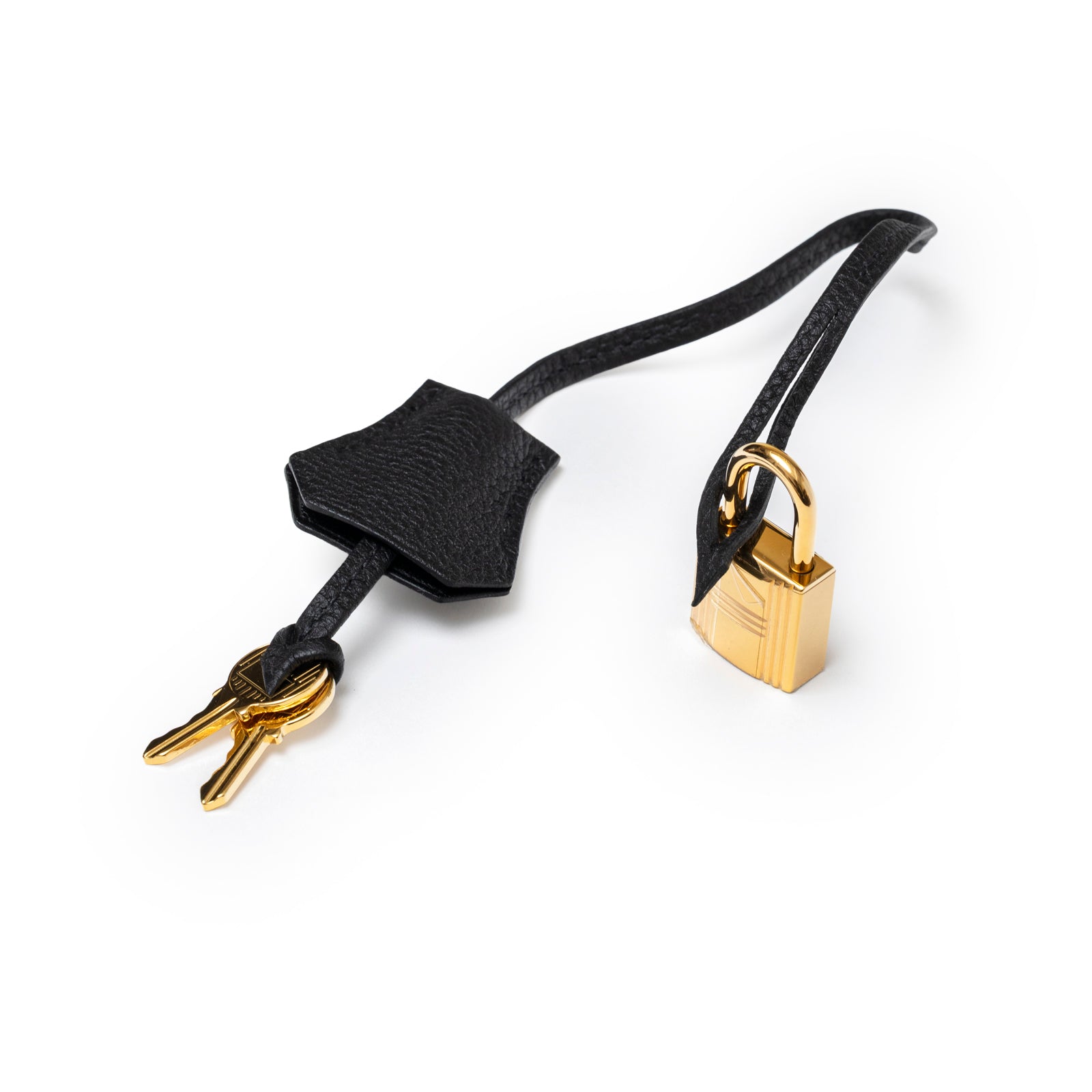 Close-up of Hermès Birkin 35 Black Togo Gold Hardware lock and keys with black leather clochette accessory.