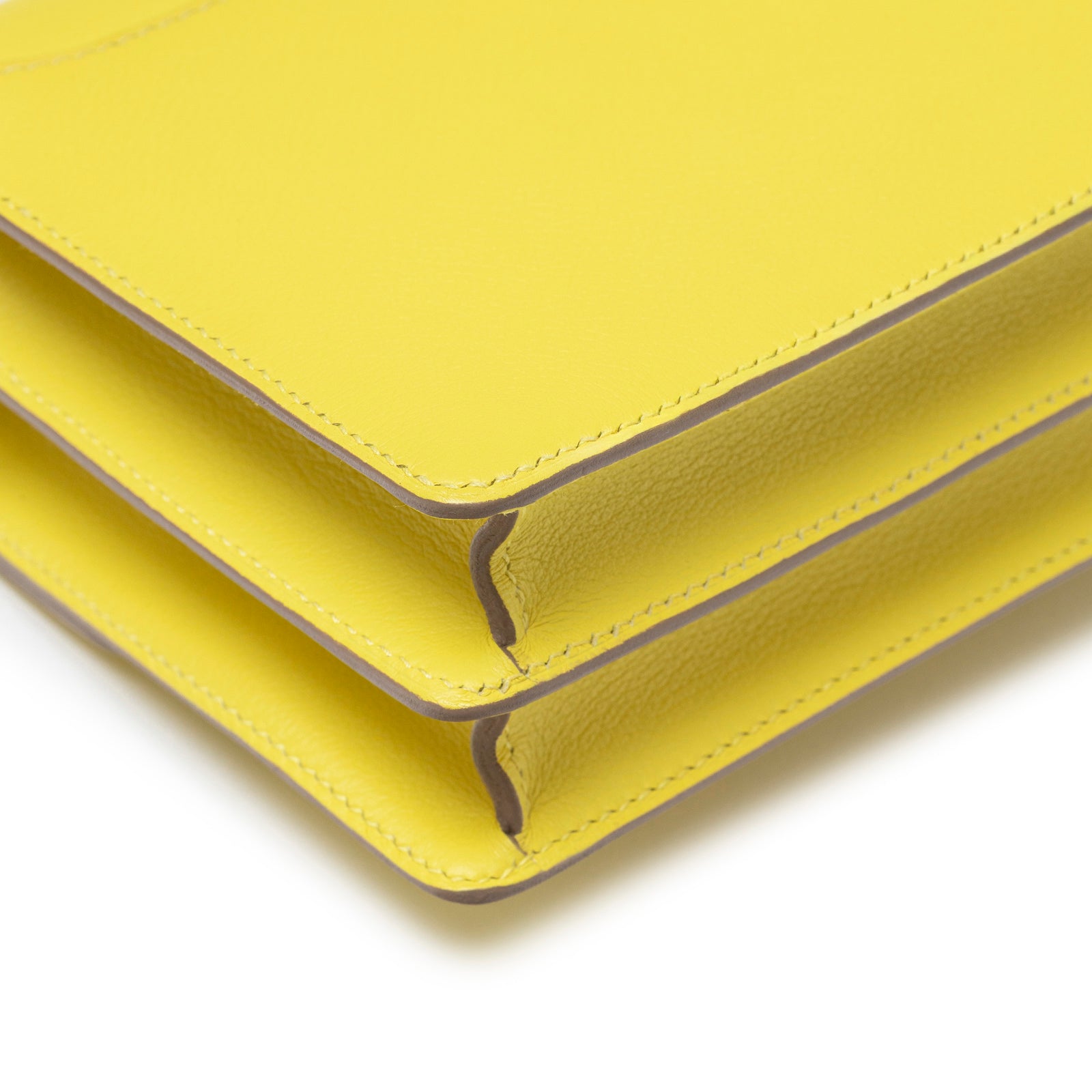 Close-up of corner stitching and edge detail on Hermès Mini Roulis Lime Evercolor Permabrass Hardware bag