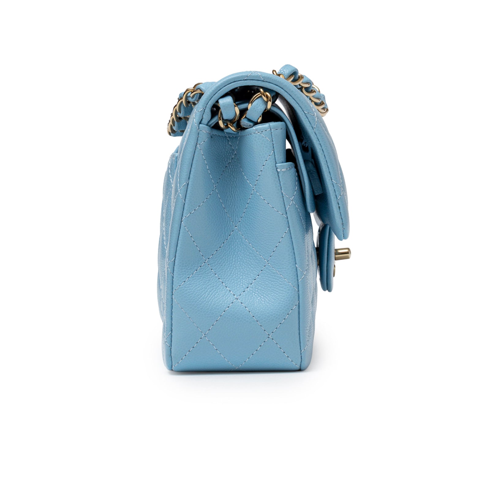 Side view of Chanel Small Classic Flap Bag Blue Caviar Light Gold Hardware showing quilted leather texture