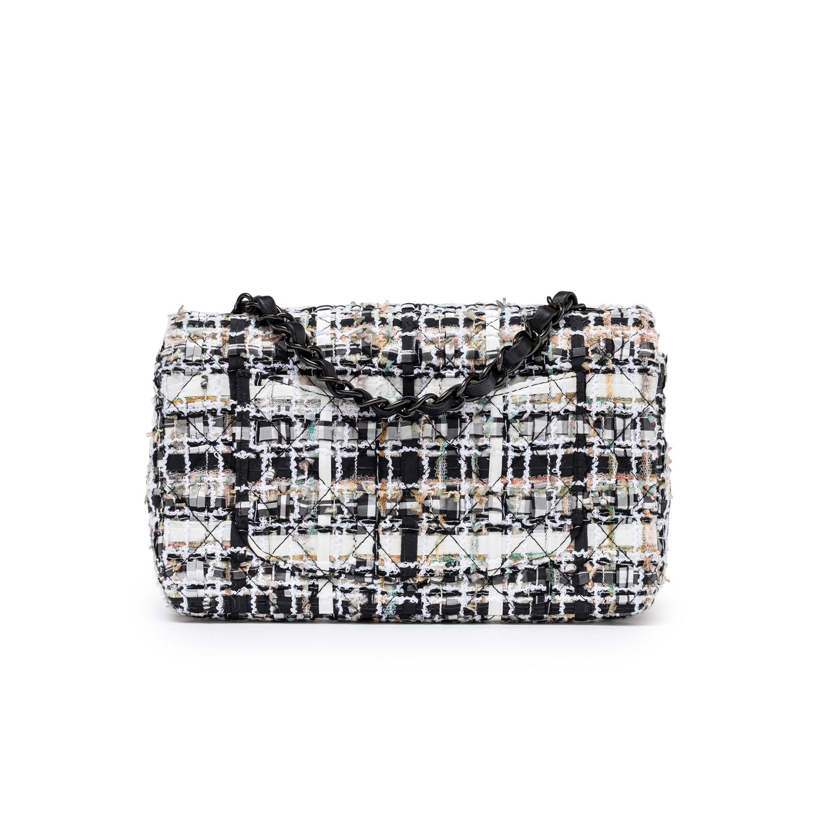 Back view of Chanel Mini Classic Flap Black and White Tweed Black Hardware with chain strap detail and quilted pattern