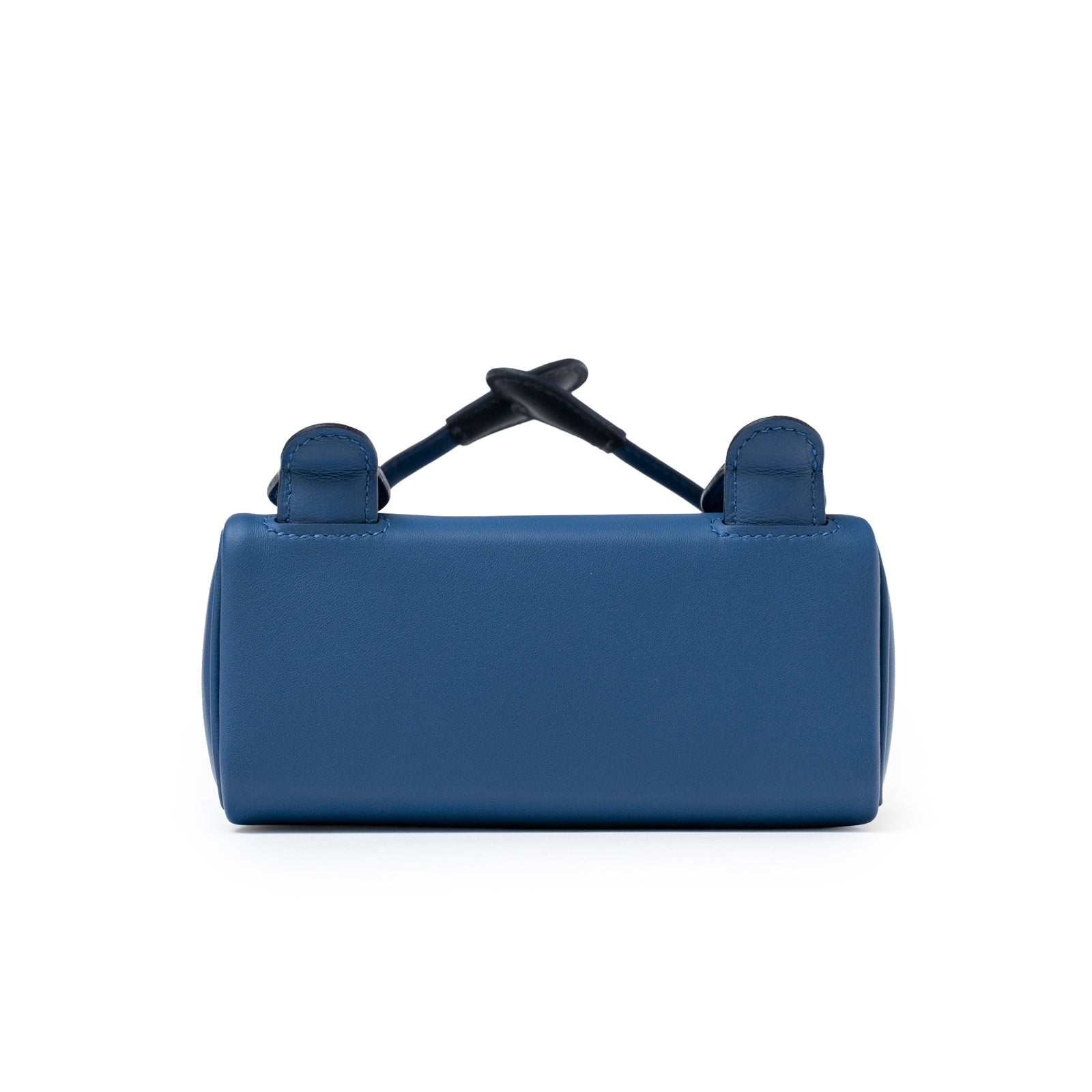 Bottom view of Hermès Quelle Idolle Kelly Doll Bleu Tie and Caban Swift Palladium Hardware showing smooth leather base and stitching details