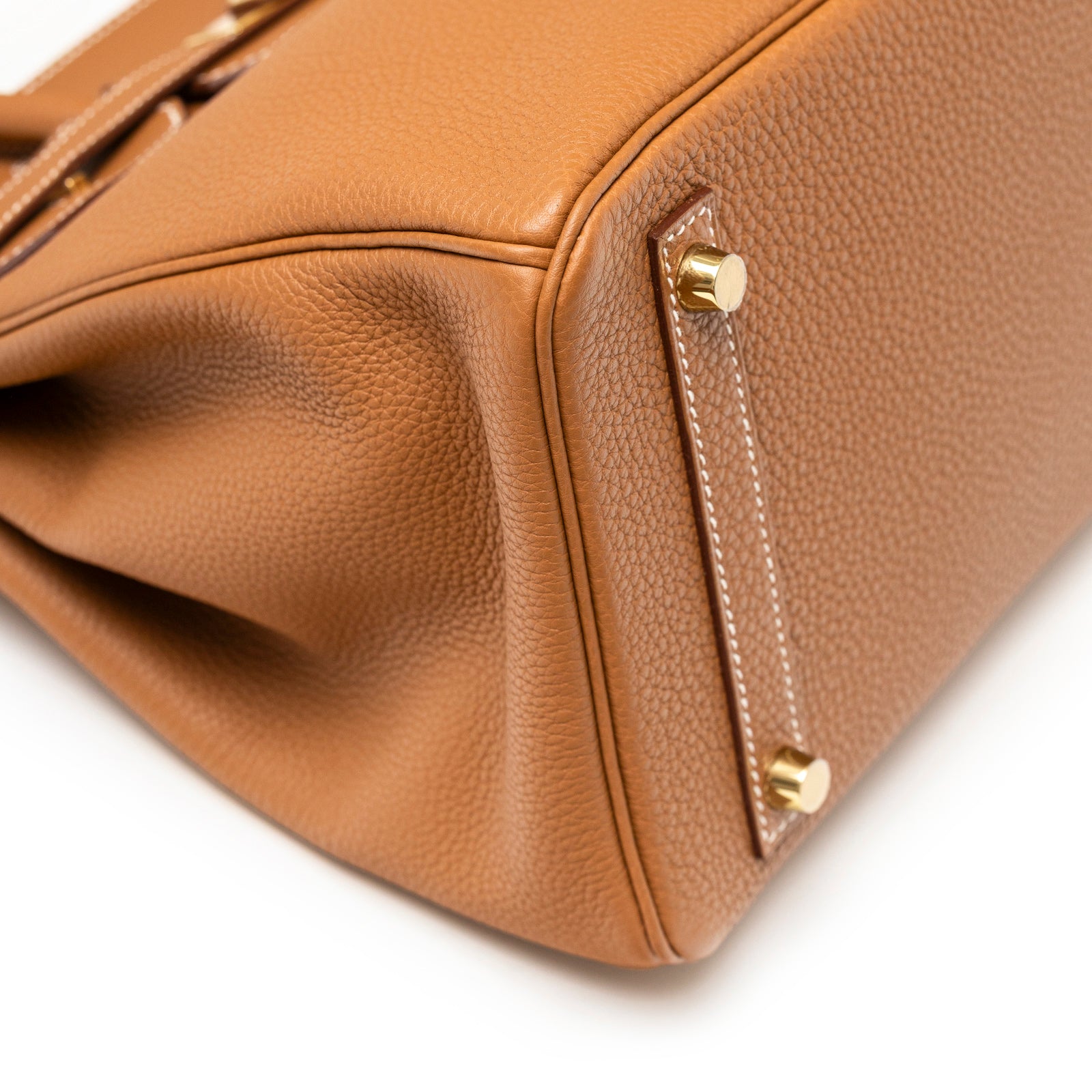 Close-up of bottom corner and gold hardware feet on Hermès Birkin 30 Gold Togo Gold Hardware bag