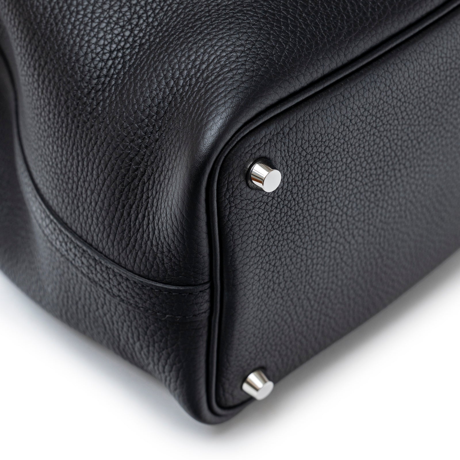 Close-up of bottom corner and palladium hardware feet on Hermès Picotin 18 Black Clemence Palladium Hardware bag