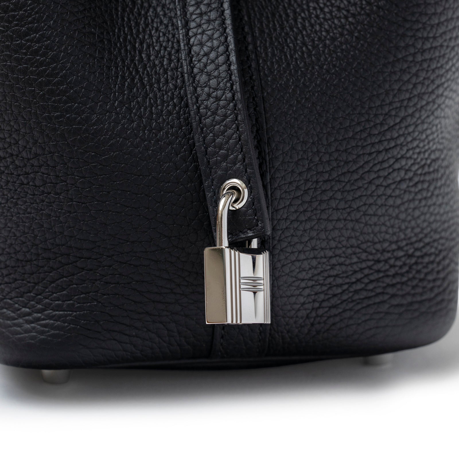 Close-up of lock and textured leather detail on Hermès Picotin 18 Black Clemence Palladium Hardware bag