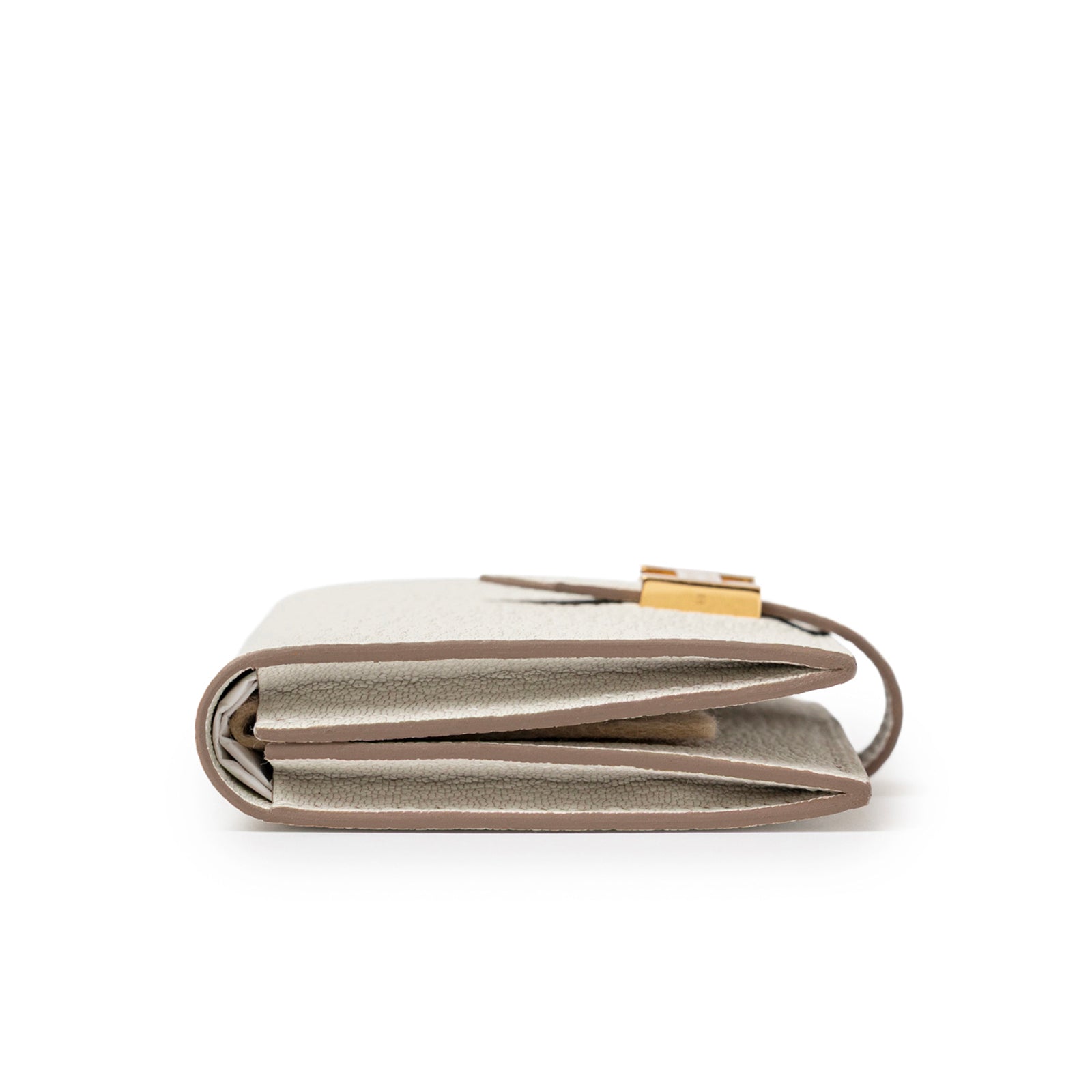 Side profile of Hermès Mini Bearn Wallet Beton Chevre Mysore Gold Hardware showing folded compact design