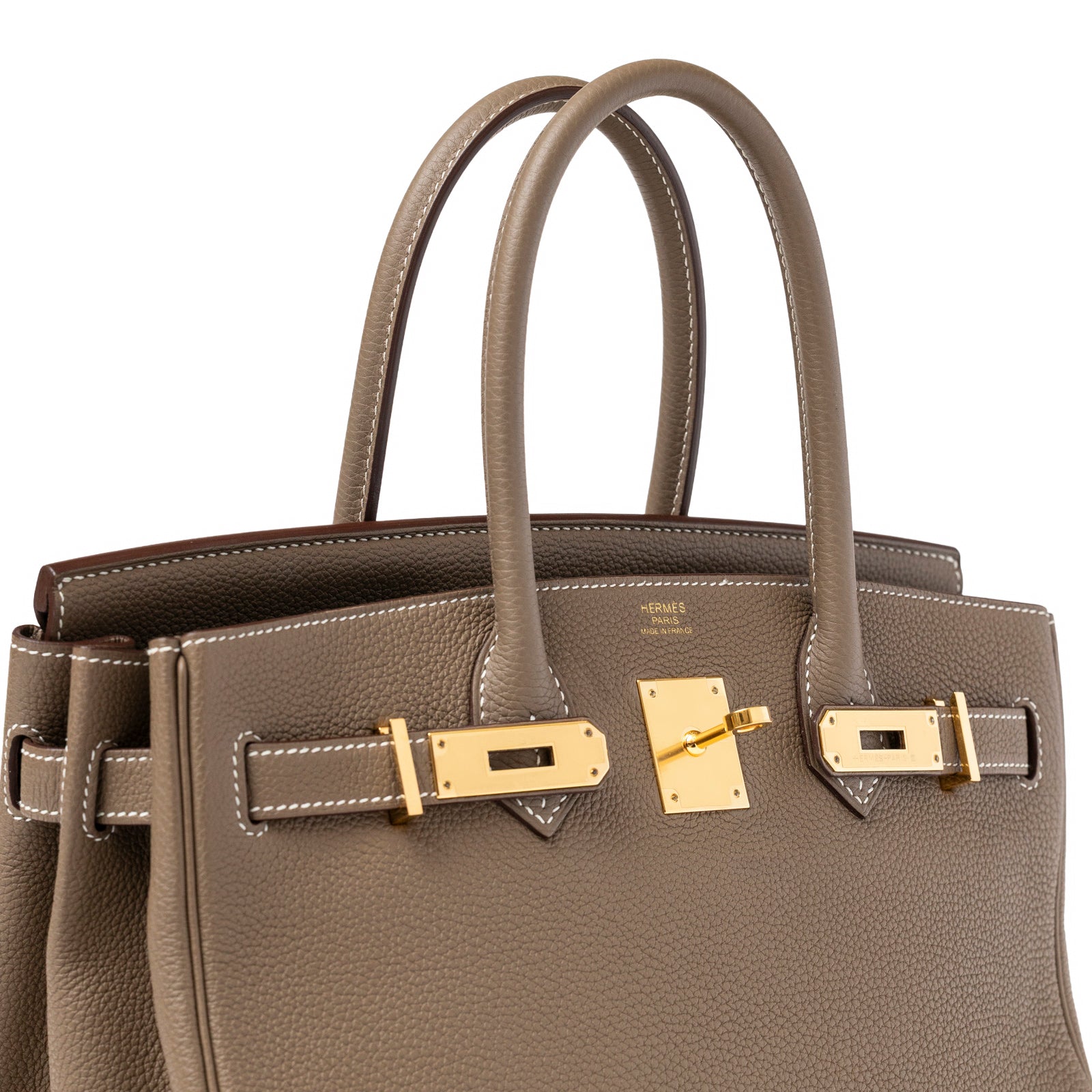 Close-up angled view of Hermès Birkin 30 Etoupe Togo Gold Hardware showing textured leather and gold clasp detail