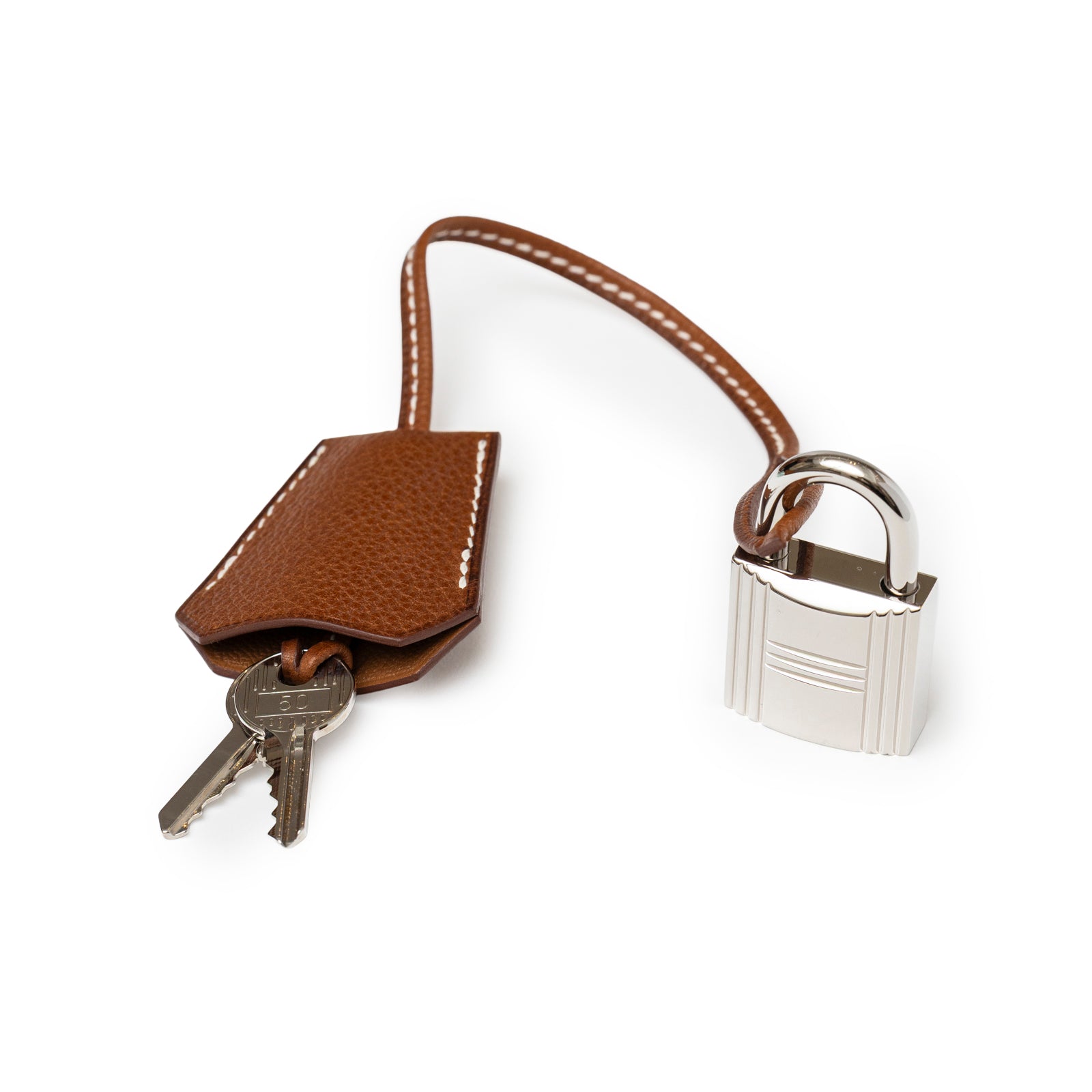 Close-up of Hermès Kelly Messenger GM Fauve Barenia Faubourg Palladium Hardware lock and key clochette detail