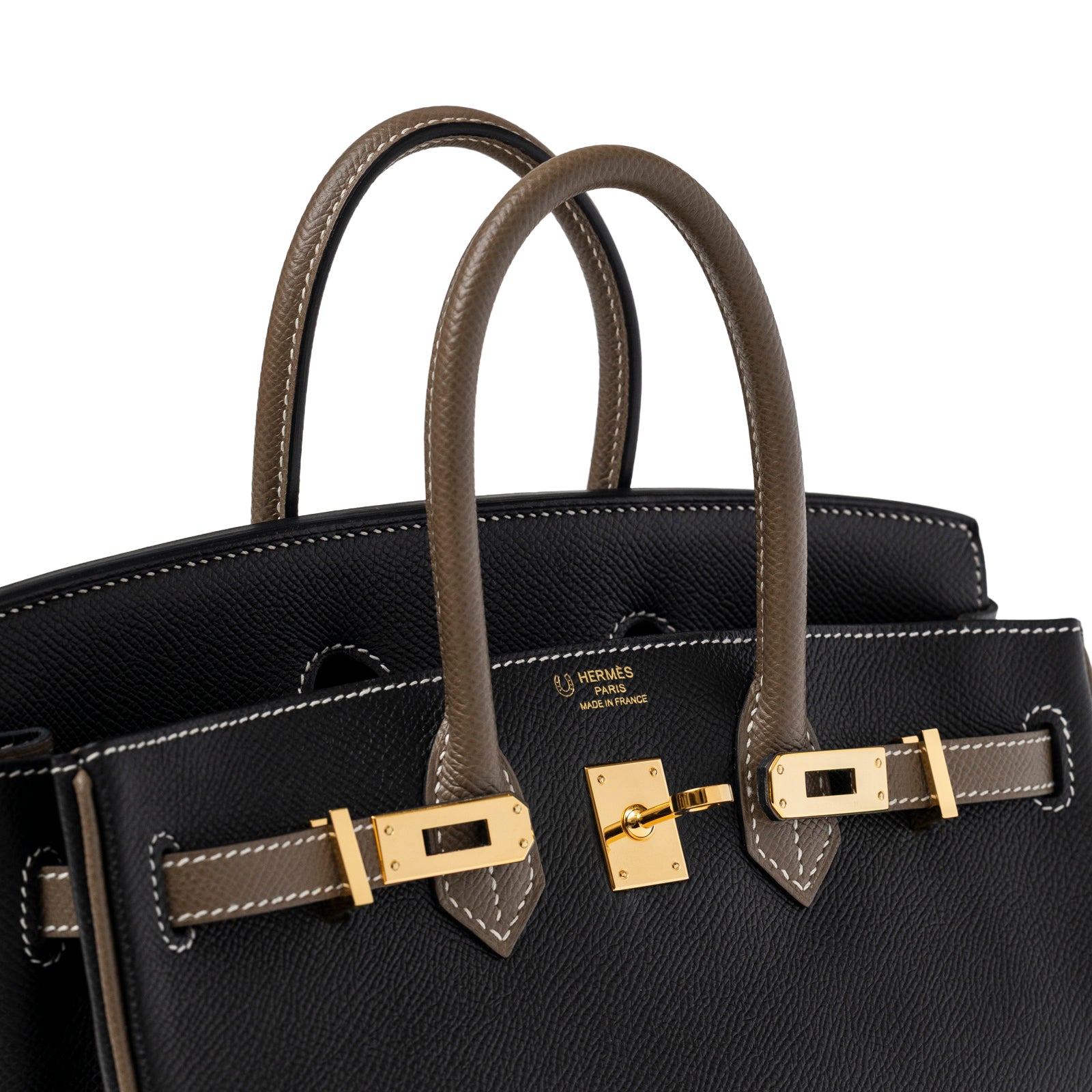 Close-up angled view of Hermès Special Order HSS Horseshoe Birkin 25 Black/Etoupe Epsom Gold Hardware handles and lock detail
