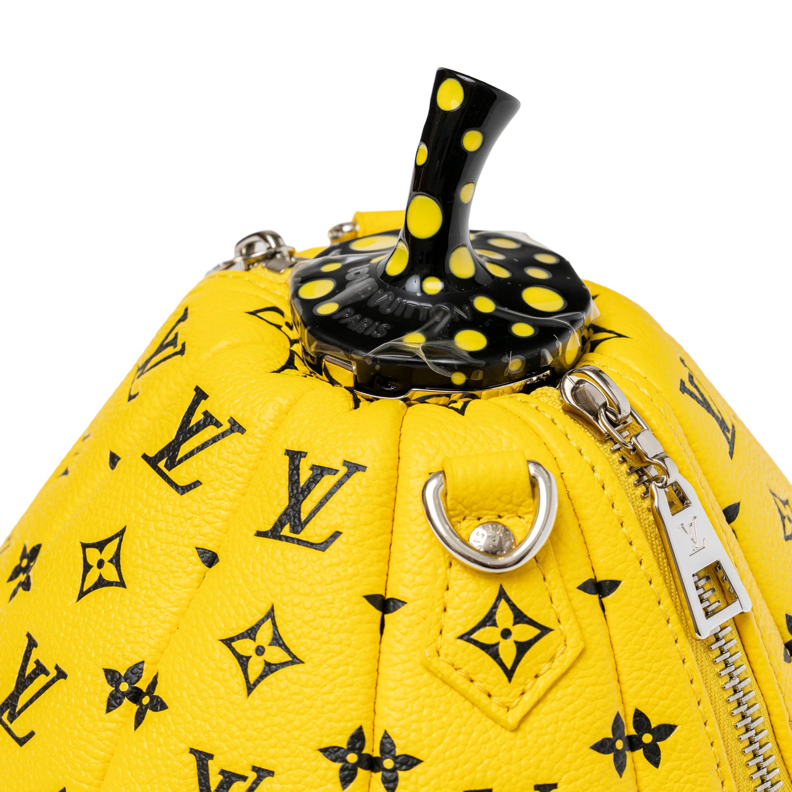 Close-up angled view of Louis Vuitton X Yayoi Kusama Limited Edition Yellow/Black Leather Pumpkin Bag top and zipper detail