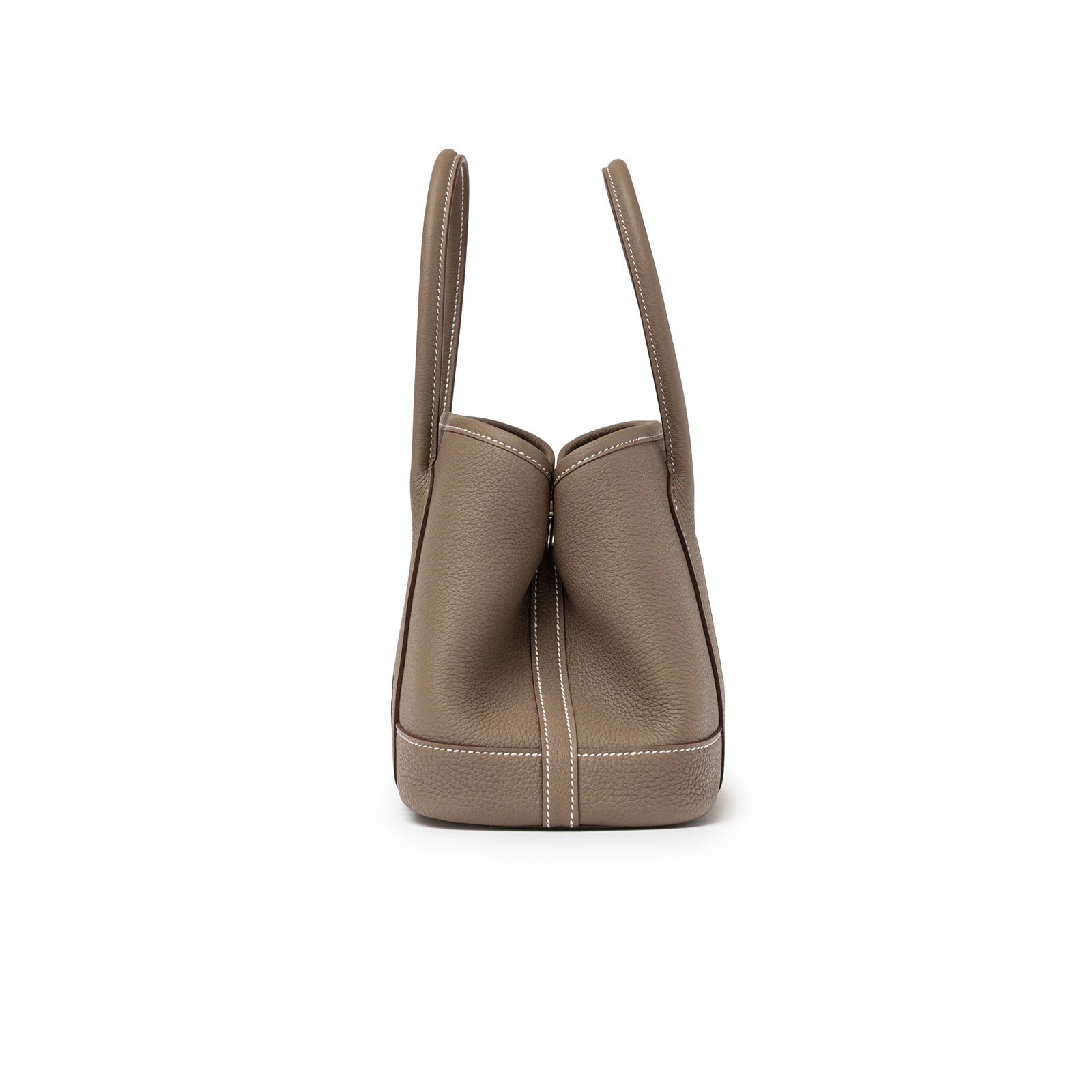 Side view of Hermès Mini Garden Party Neo 23 Etoupe Negonda Palladium Hardware handbag showing smooth leather texture and stitching