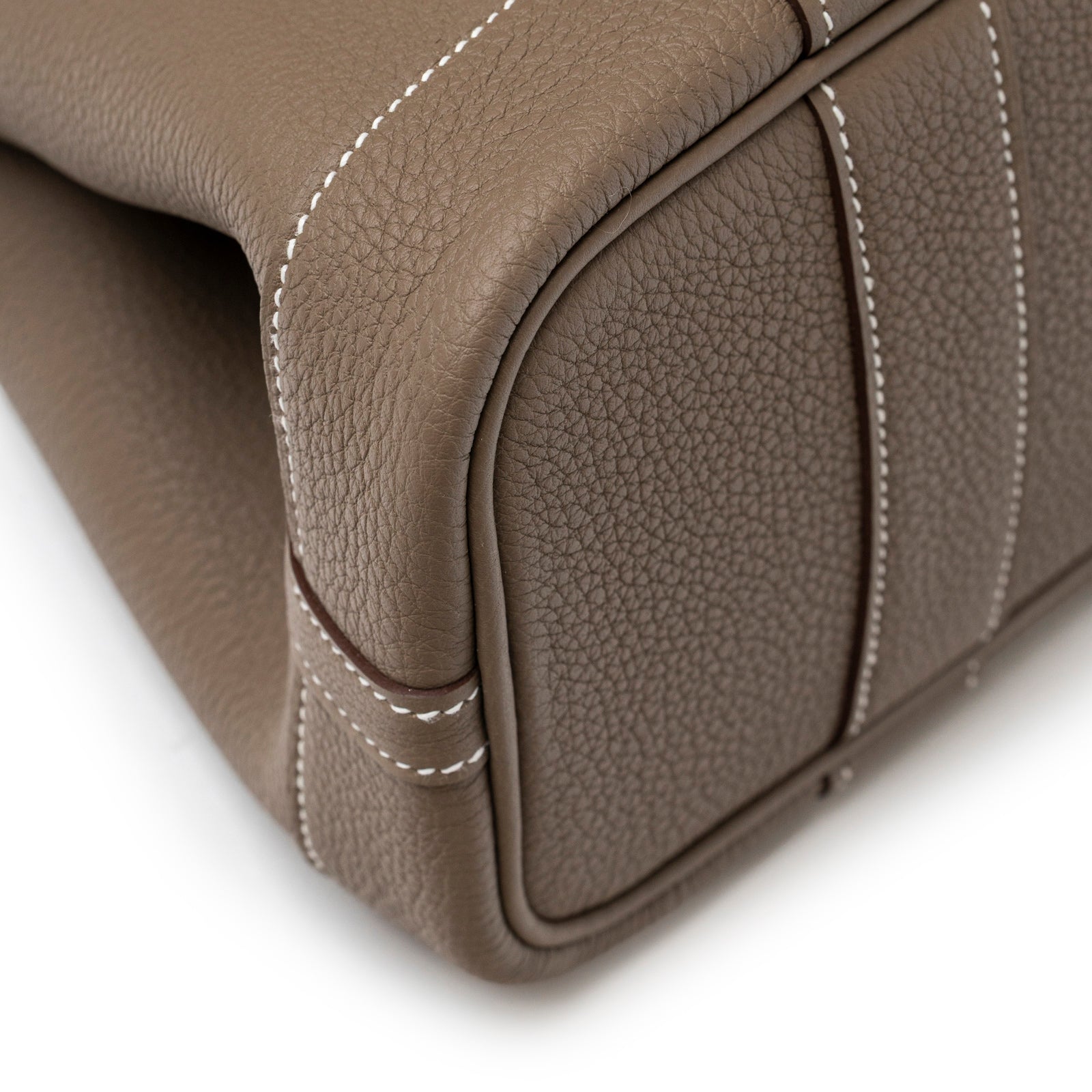 Close-up angled view of Hermès Mini Garden Party Neo 23 Etoupe Negonda Palladium Hardware corner stitching detail