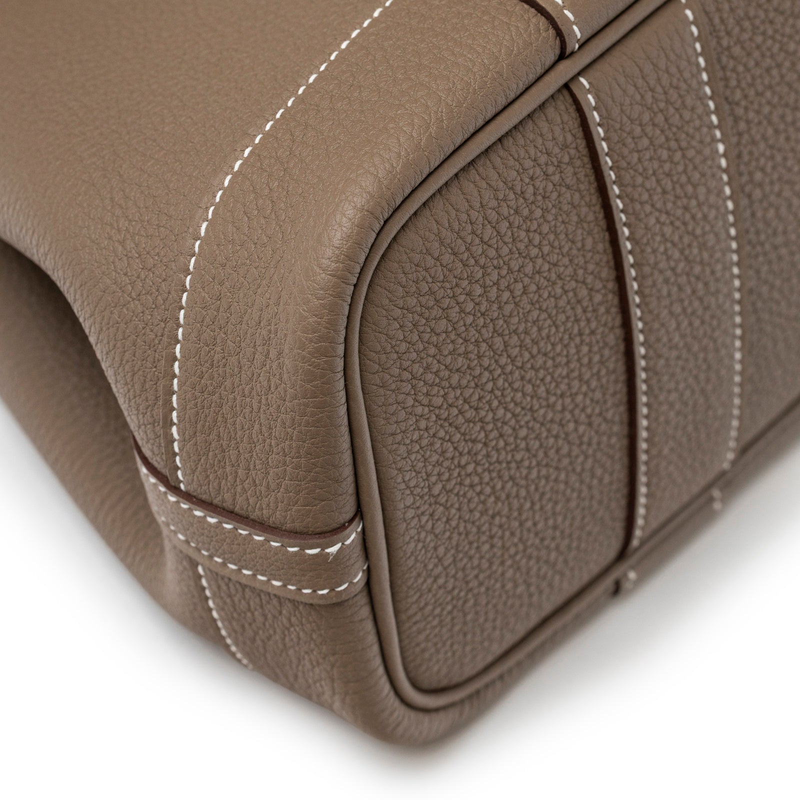 Close-up angled view of Hermès Mini Garden Party Neo 23 Etoupe Negonda Palladium Hardware corner and stitching detail