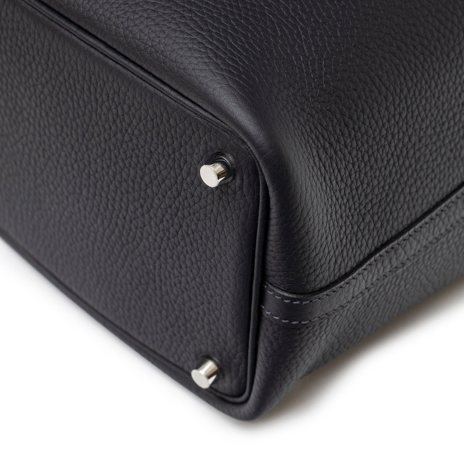 Close-up angled view of Hermès Picotin 18 Plomb Clemence Palladium Hardware bag bottom corner and metal feet detail