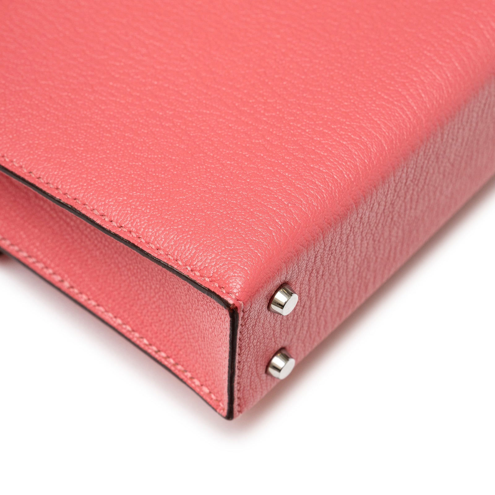 Close-up angled view of Hermès Mini Verrou Chaine Bag Rose Azalee Chevre Mysore Palladium Hardware corner detail