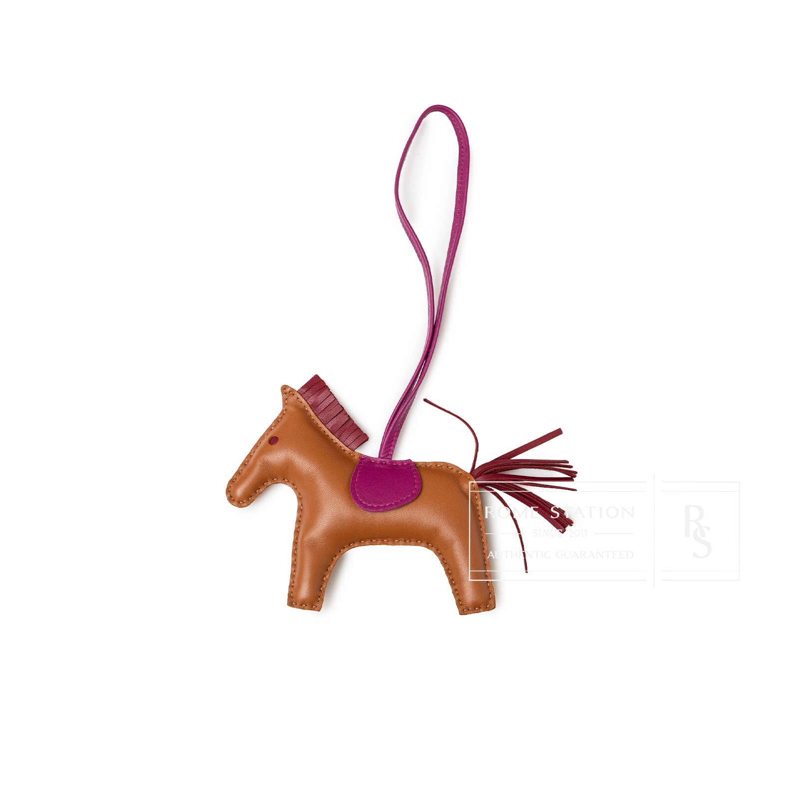Top-down view of Hermès Rodeo Bag Charm MM Gold/Rubis/Rose Pourpre Milo Lambskin horse shape with leather strap