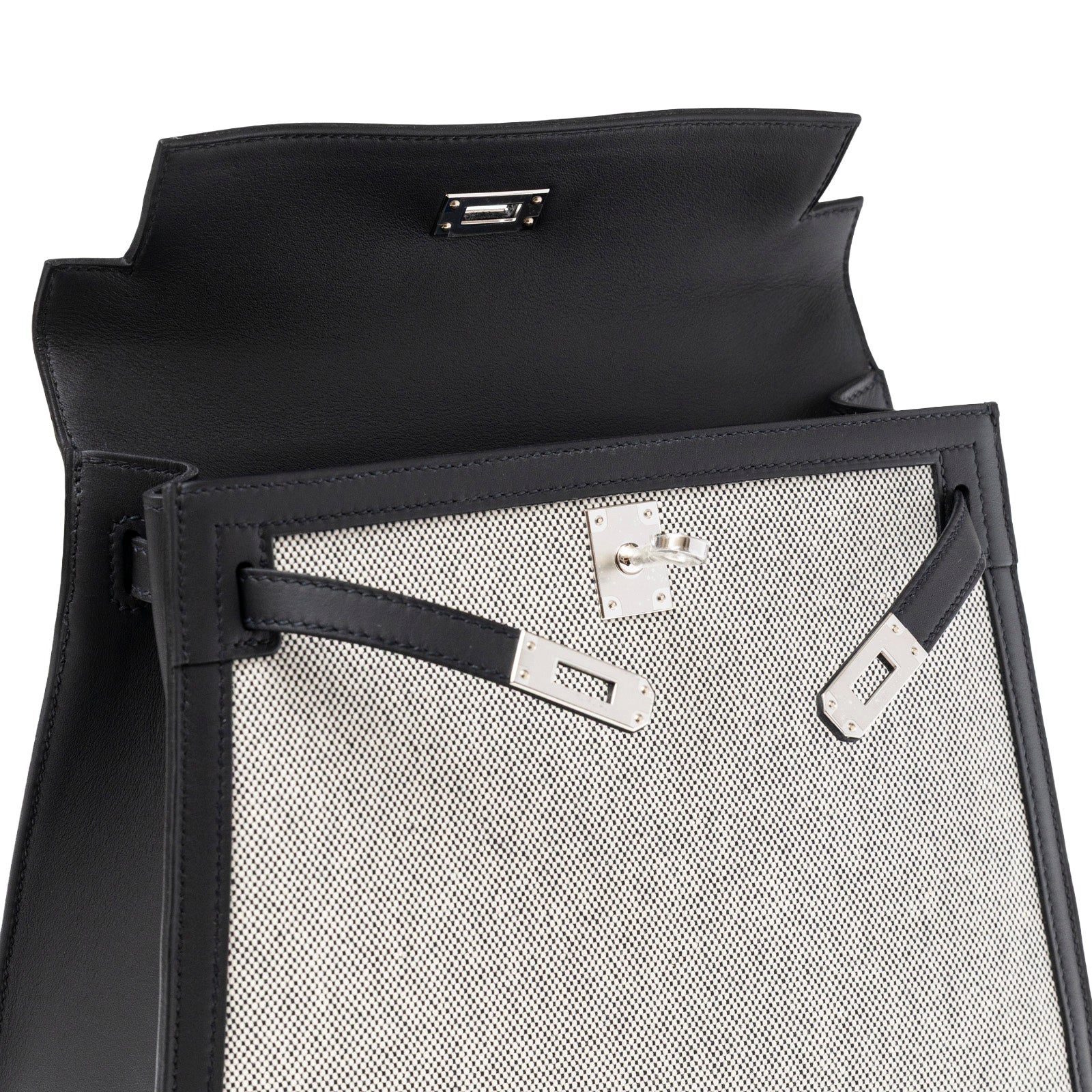 Close-up of interior and flap showing palladium hardware on Hermès Kelly 25 Sellier Ecru Black Swift Toile H Canvas Swift Palladium Hardware