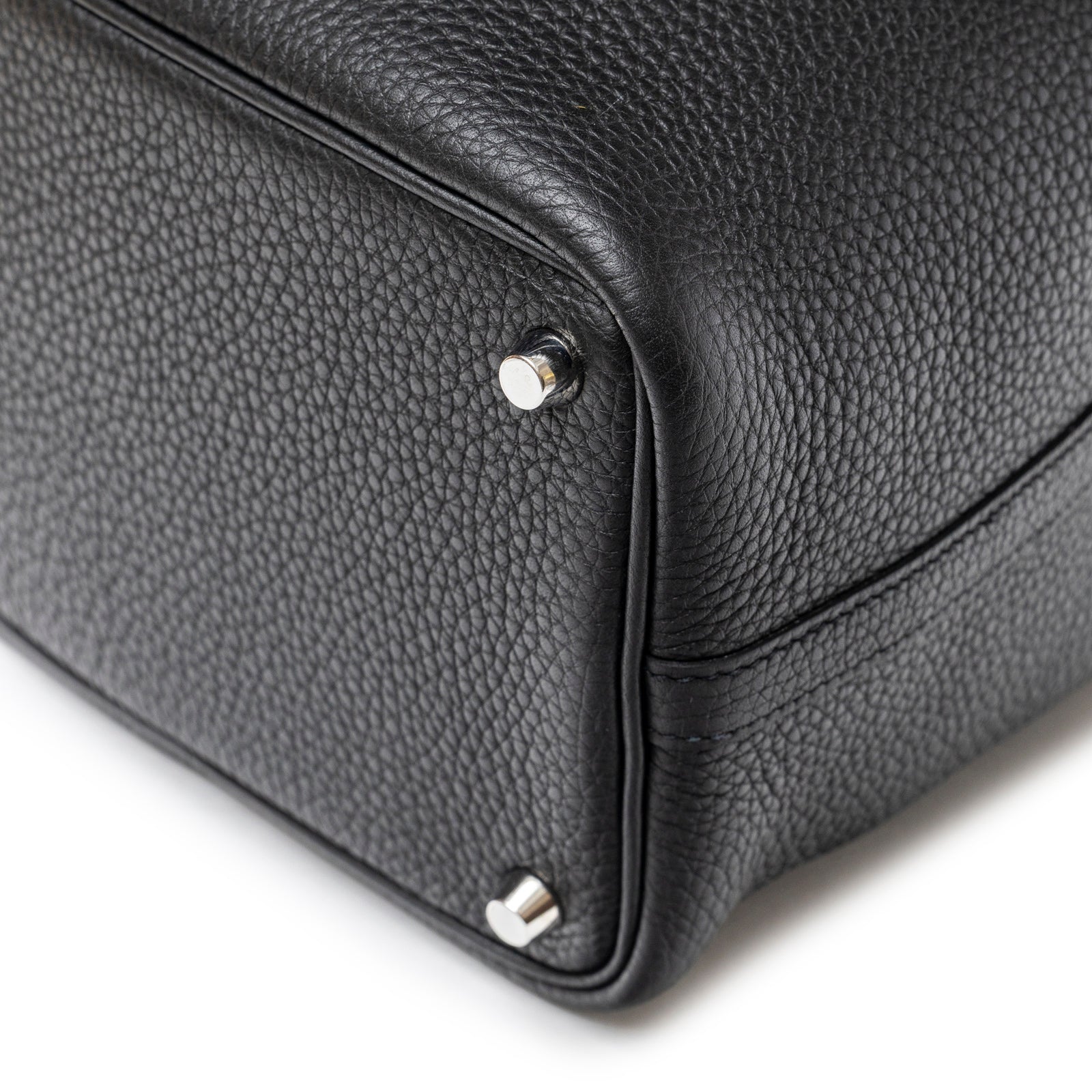 Close-up of bottom corner with palladium hardware on Hermès Picotin 18 Black Clemence Palladium Hardware bag