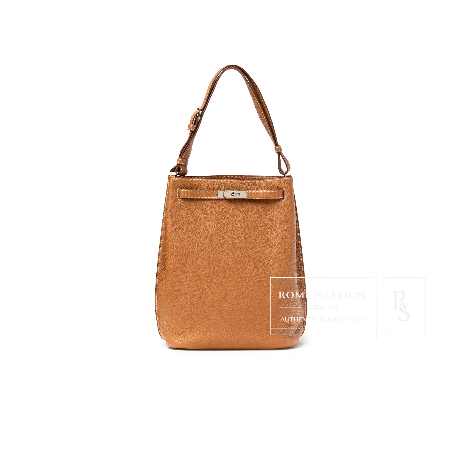 Front view of Hermès So Kelly 26 Gold Togo Gold Palladium Hardware tote with adjustable strap and clasp details