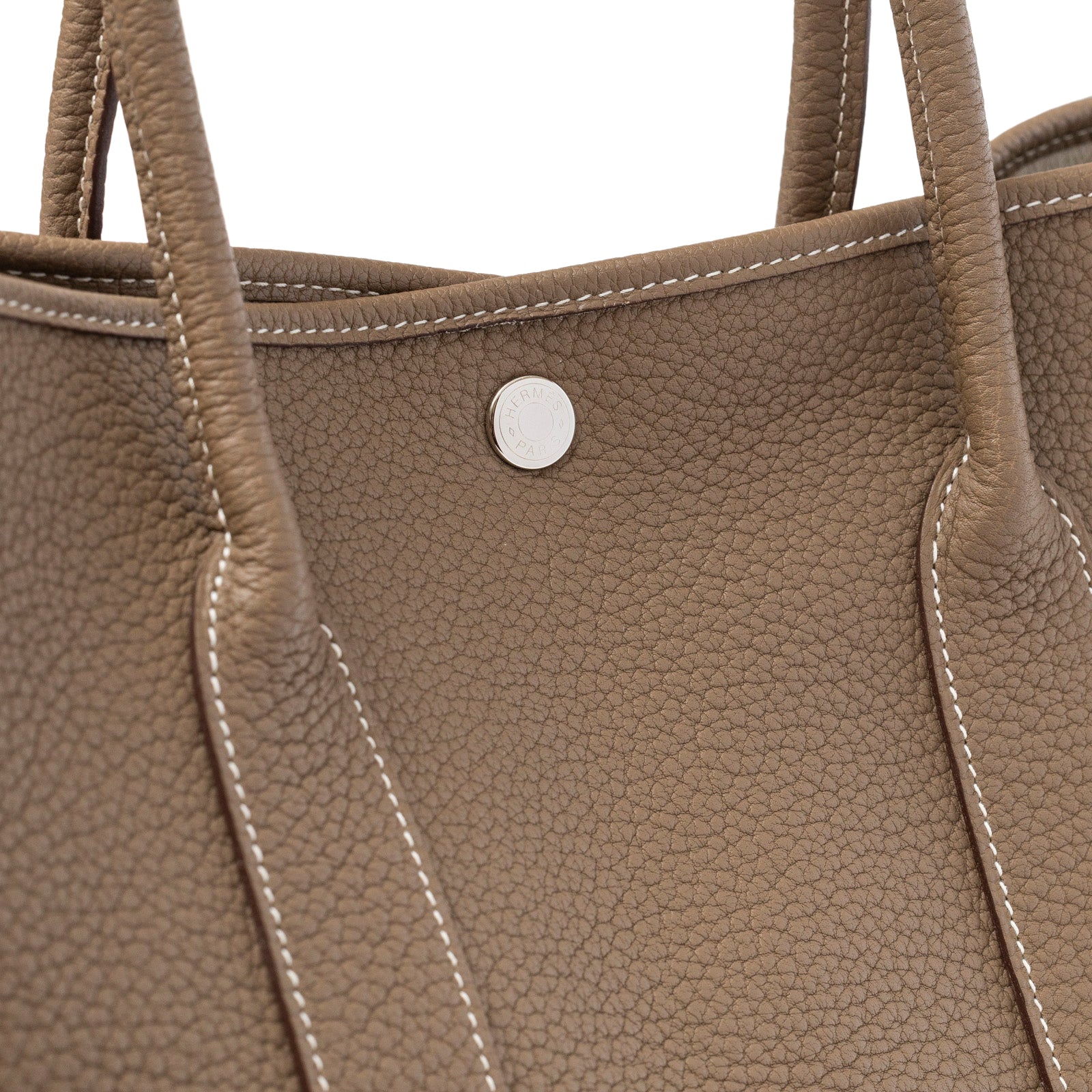 Close-up of Hermès Garden Party 36 Etoupe Negonda Palladium Hardware textured leather and stitching detail