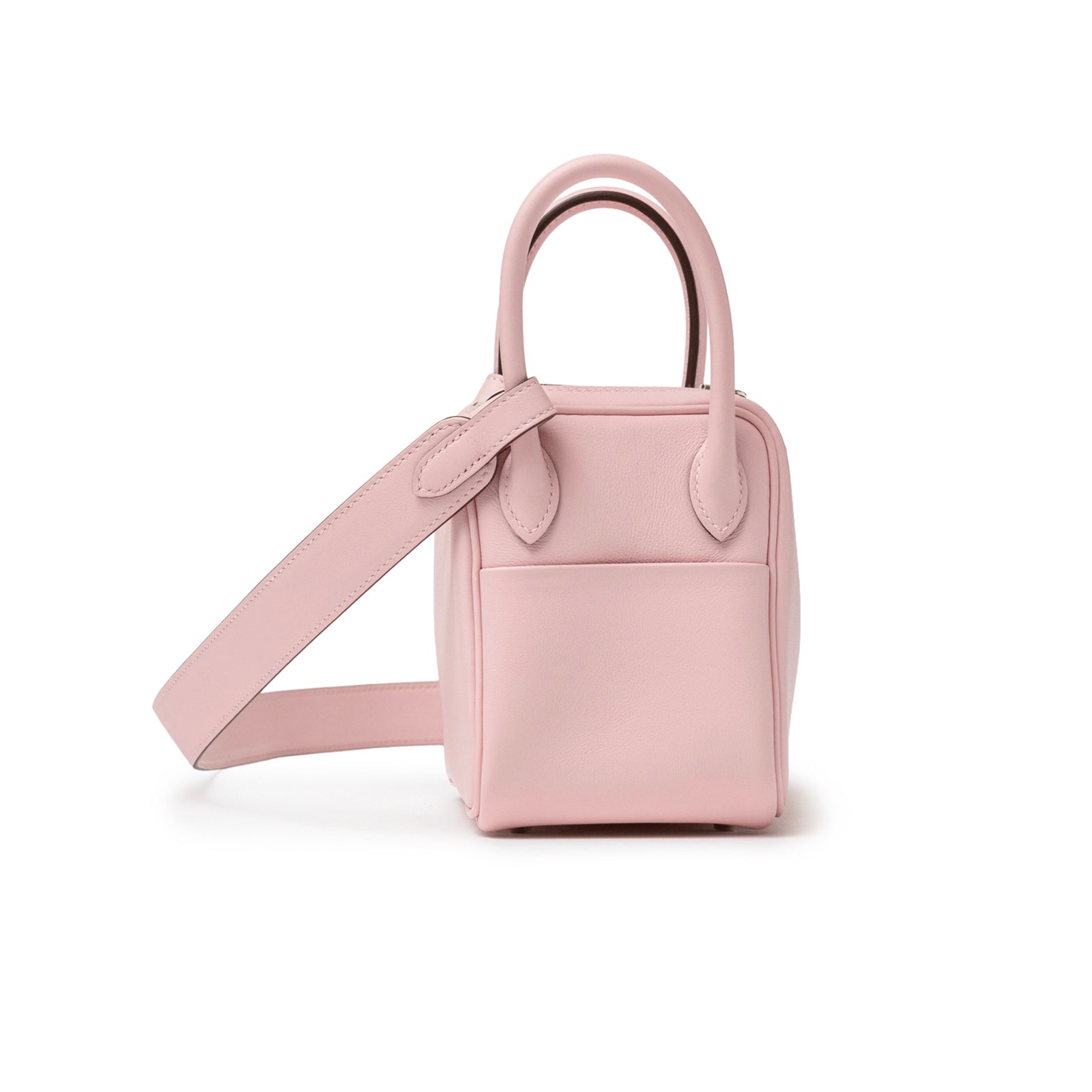 Side view of Hermès Mini Lindy II Rose Sakura Swift Palladium Hardware with shoulder strap visible