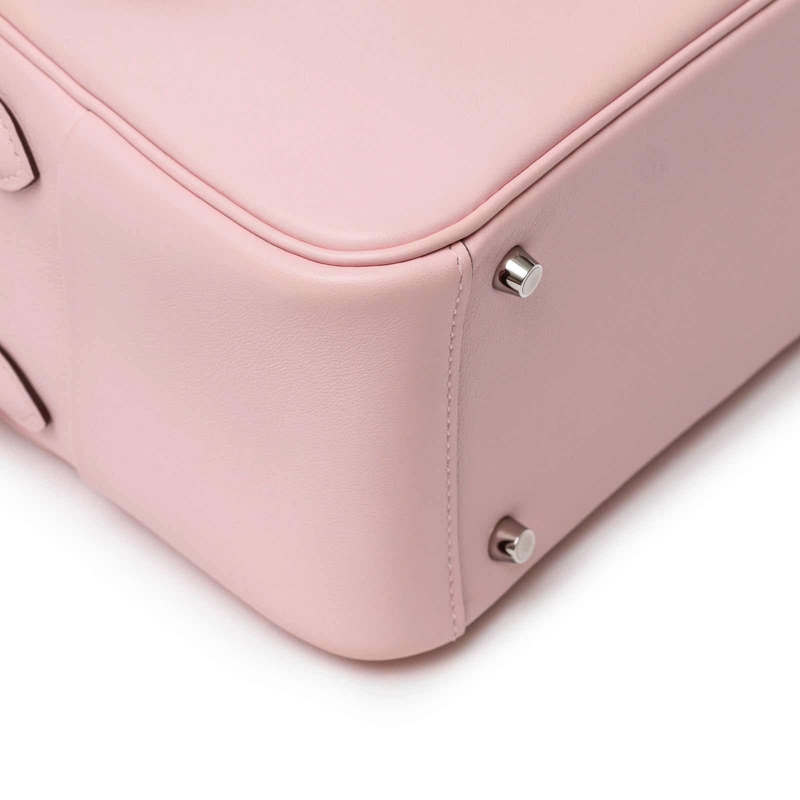 Close-up of bottom corner showing palladium hardware feet on Hermès Mini Lindy II Rose Sakura Swift Palladium Hardware