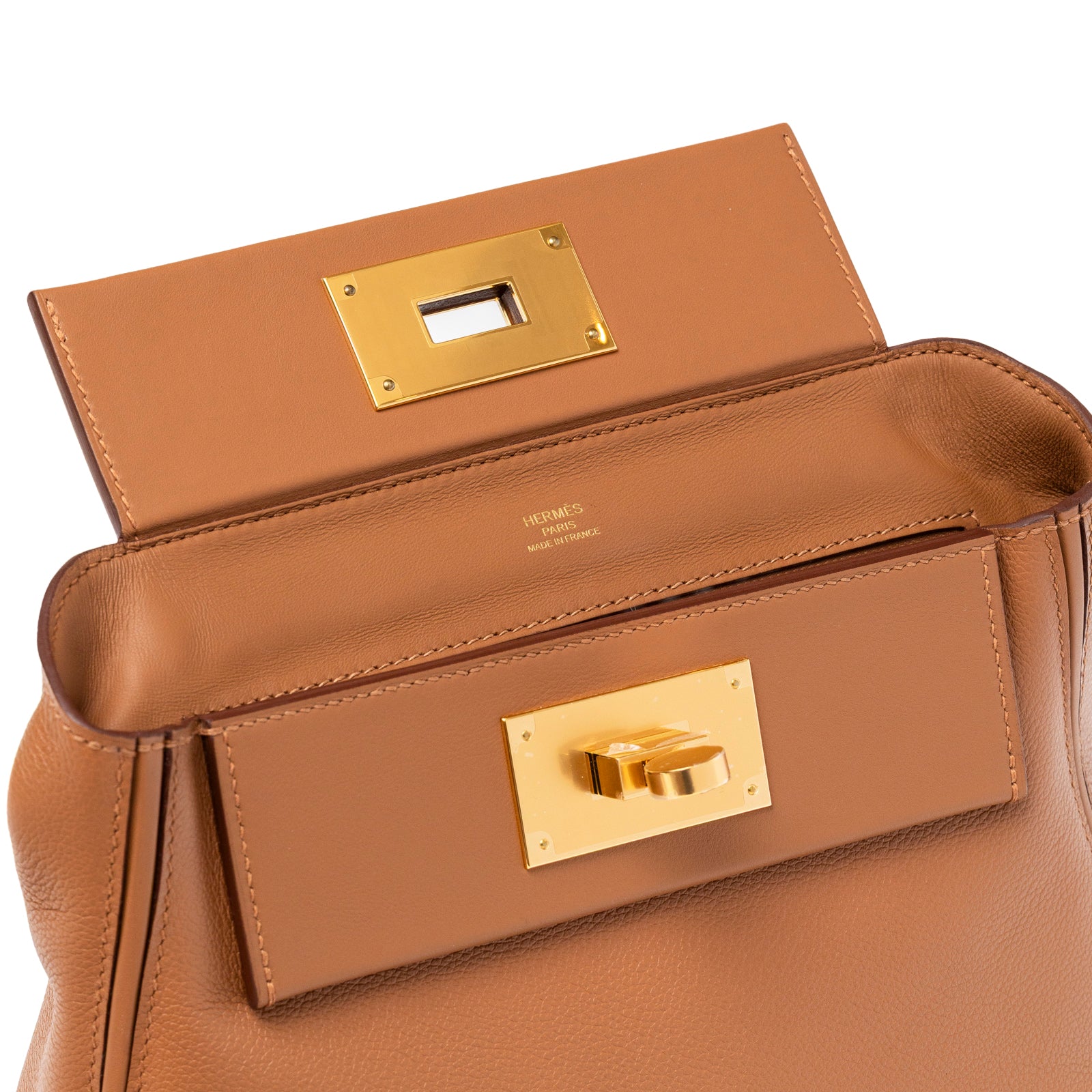 Close-up interior view of Hermès 24/24 21 Gold Evercolor Swift Gold Hardware showing flap and gold clasp details