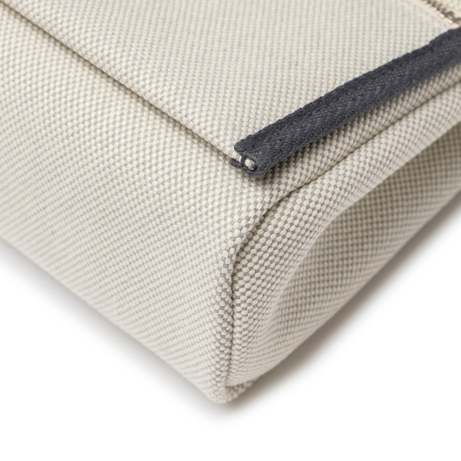 Close-up corner detail of Hermès Mini Herbag Zip 20 Ecru-Blue Glacier/Ardoise Toile and Vache Hunter Palladium Hardware