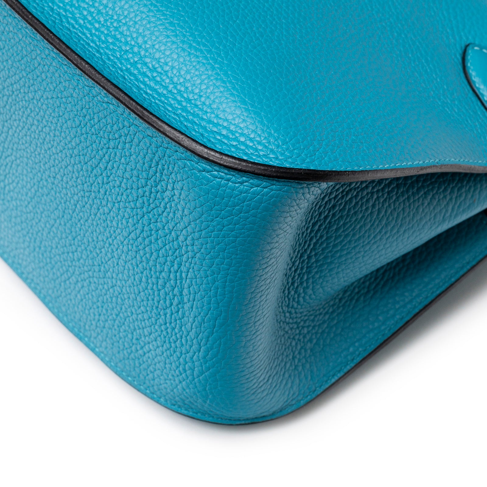 Close-up of bottom corner showing turquoise Clemence leather texture on Hermès Jypsiere 31 Turquoise Clemence Palladium Hardware